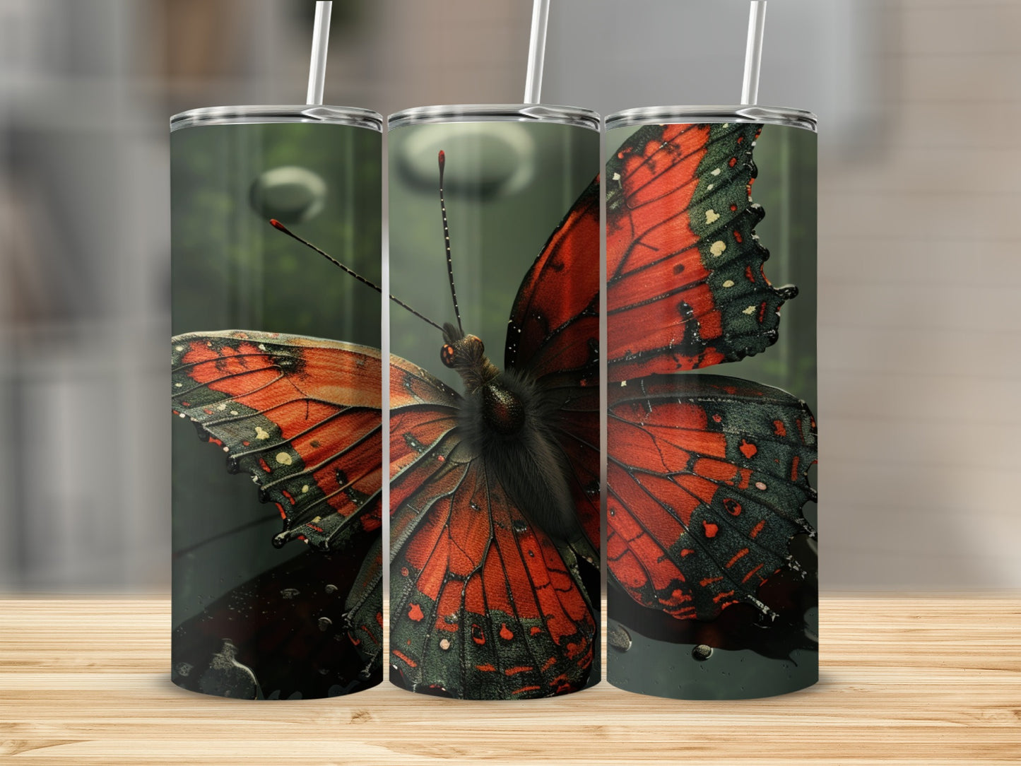 Three tumblers with a close-up view of a red and black butterfly.