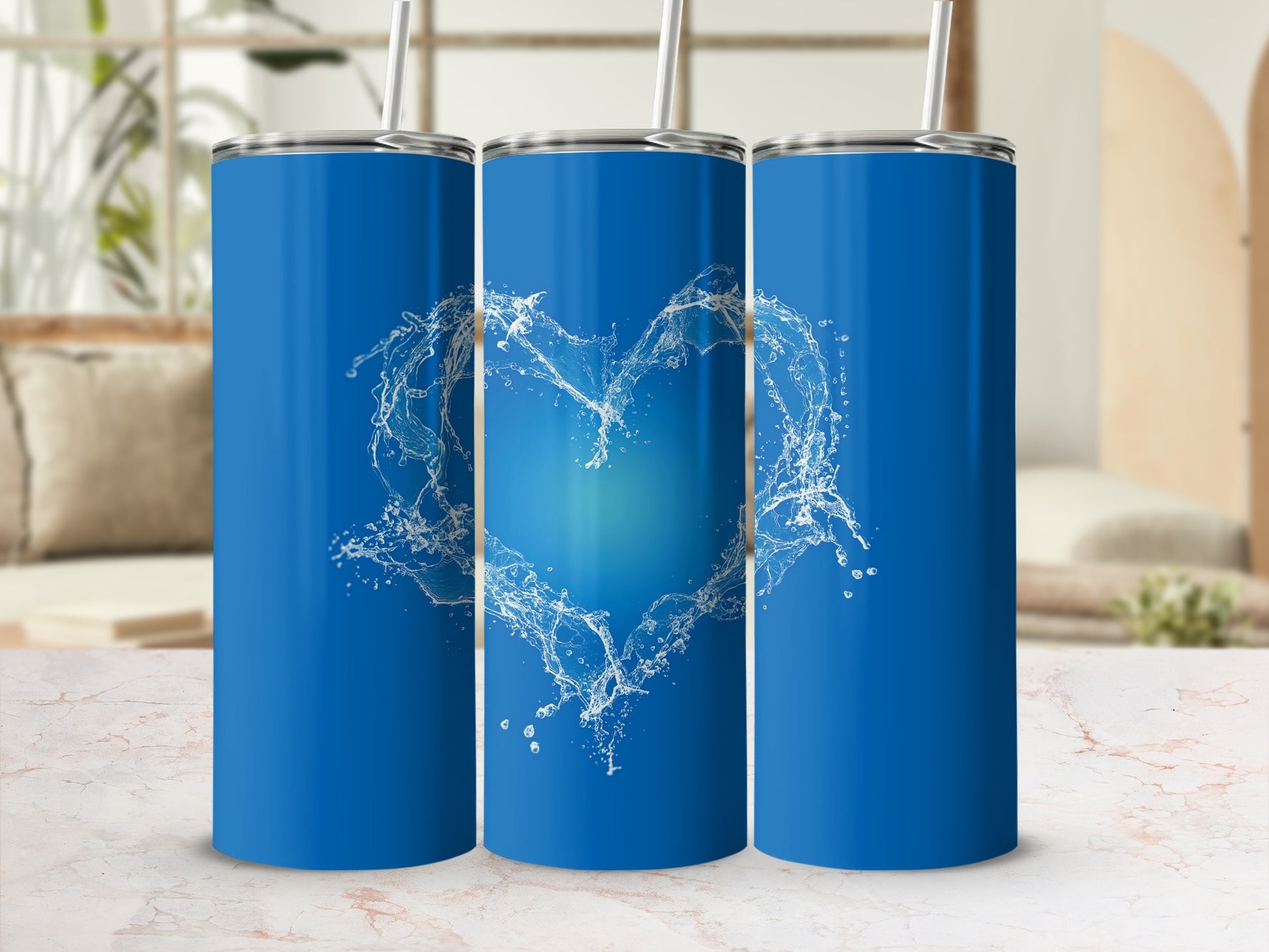 Blue tumbler with water splash heart design.
