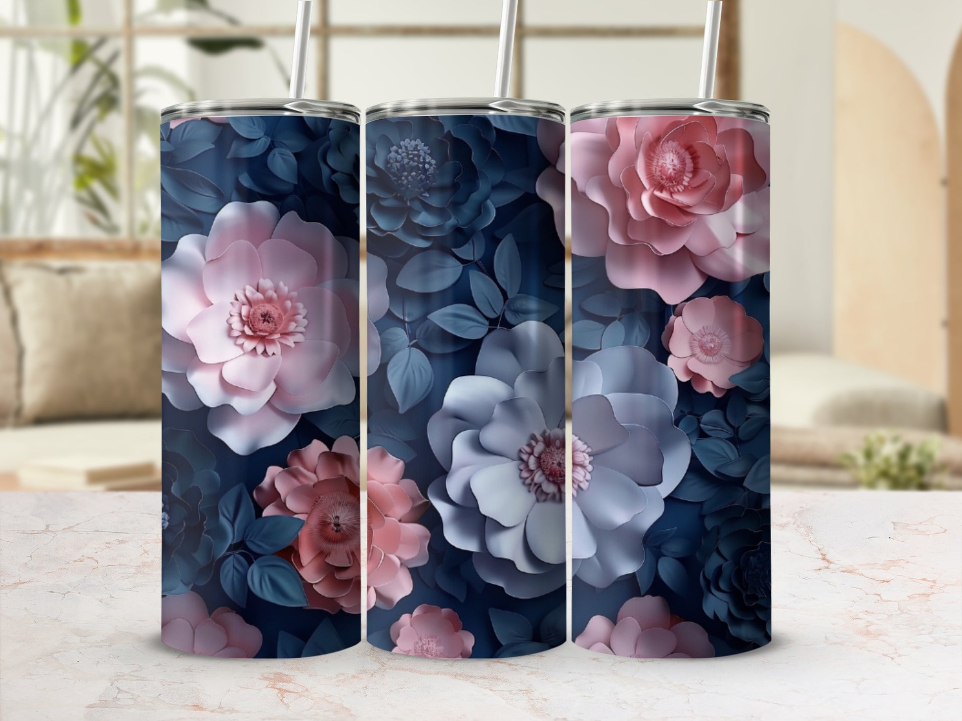 Three tumblers with a dark floral design, featuring pink and blue paper flowers.
