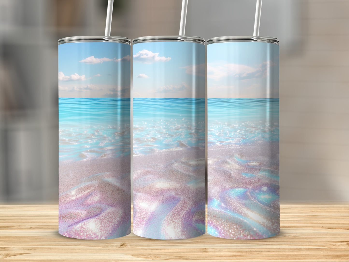 Three tall tumblers with a beachy sky and water design.