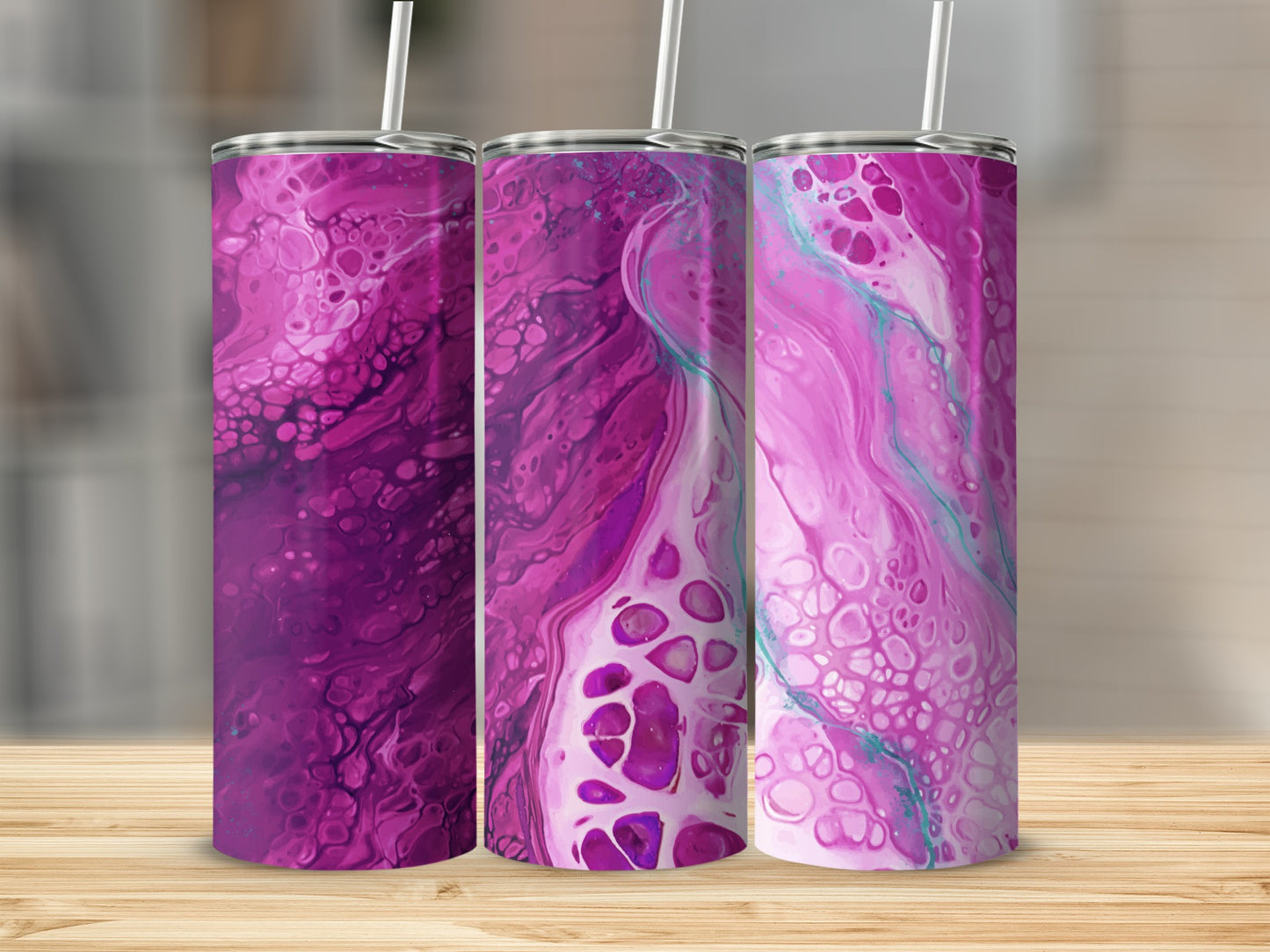 Three tumblers with marbled pink and purple designs and straws.