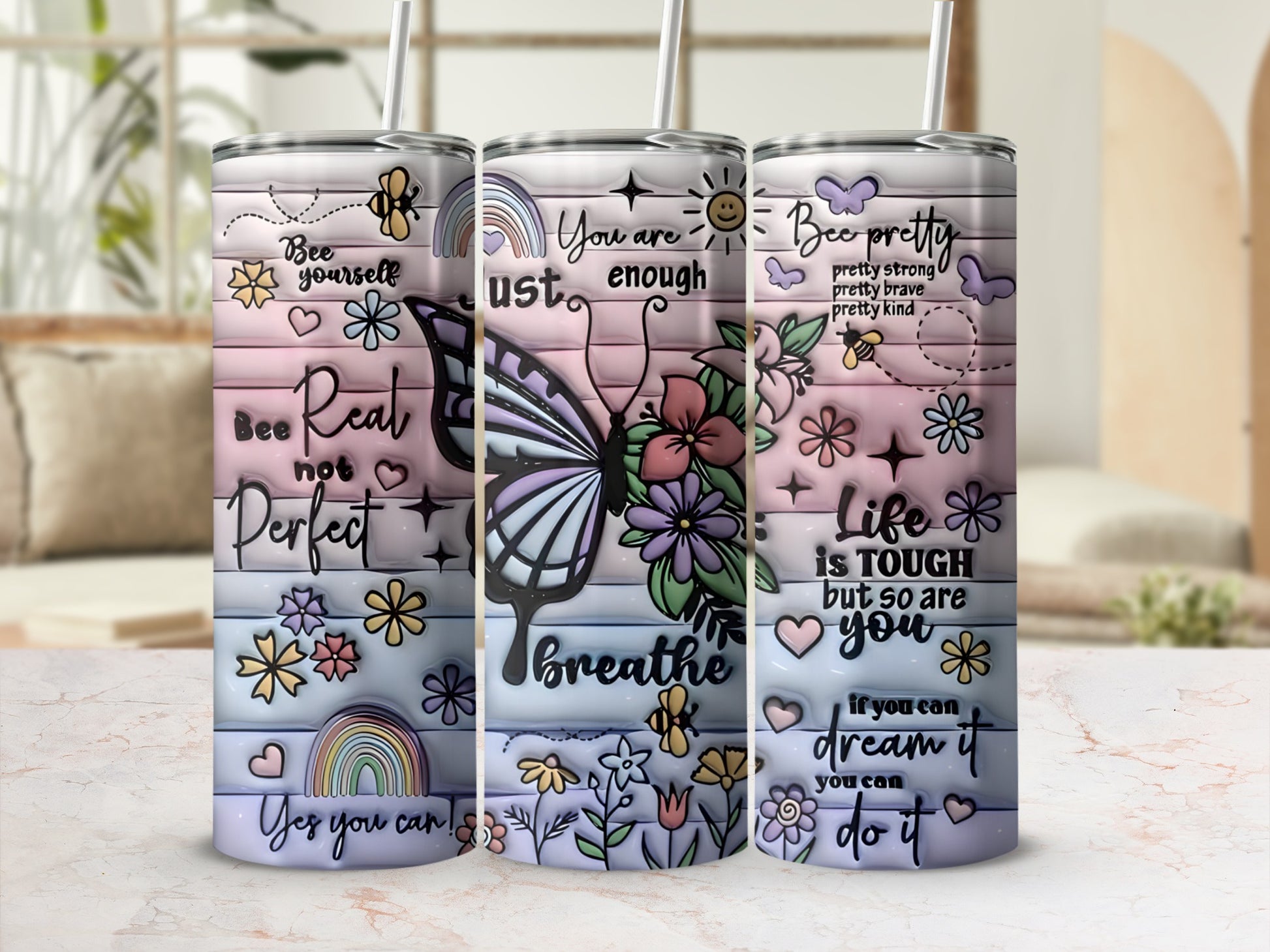 Tumbler with butterfly, flowers, rainbows, and inspirational text.