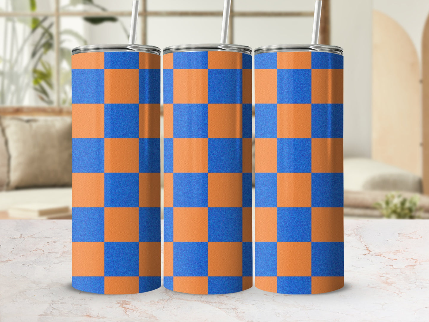 Three tall tumblers with orange and blue checkered pattern.