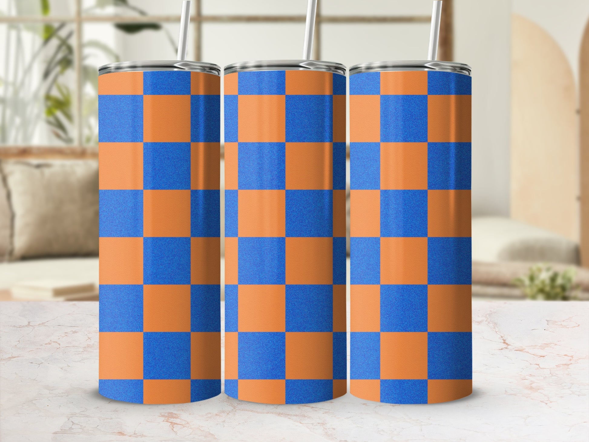 Three tall tumblers with orange and blue checkered pattern.