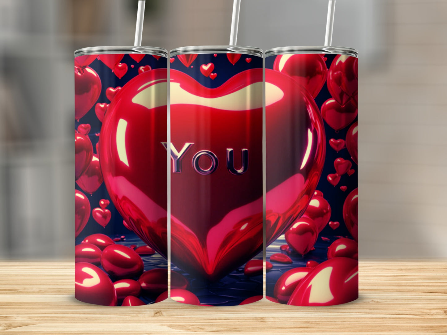 Three red heart-shaped tumblers with "YOU" on the center one.