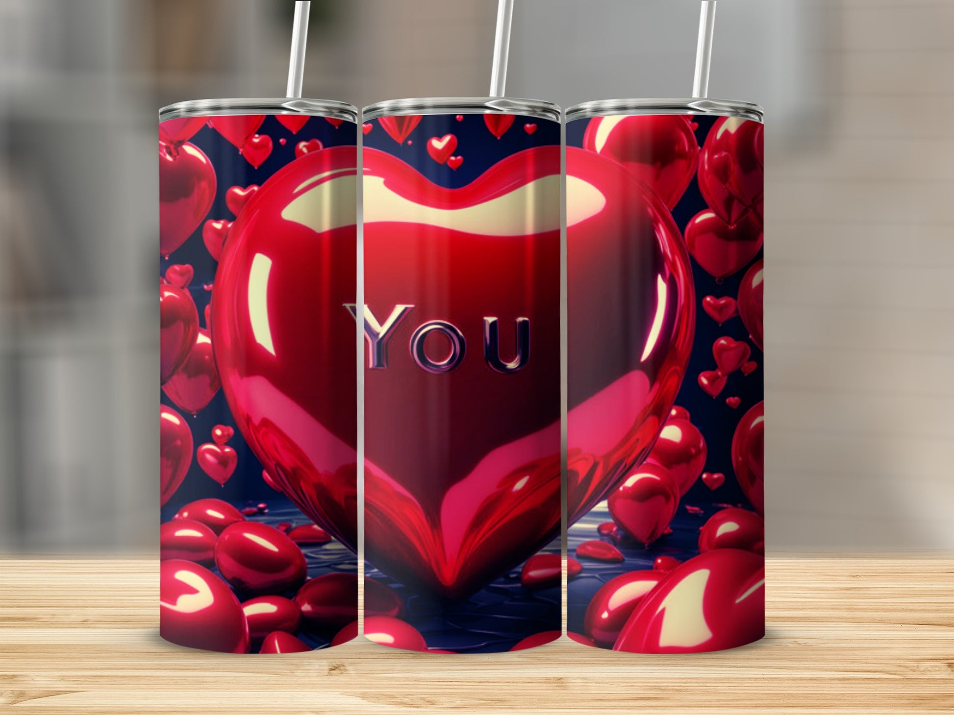 Three red heart-shaped tumblers with "YOU" on the center one.