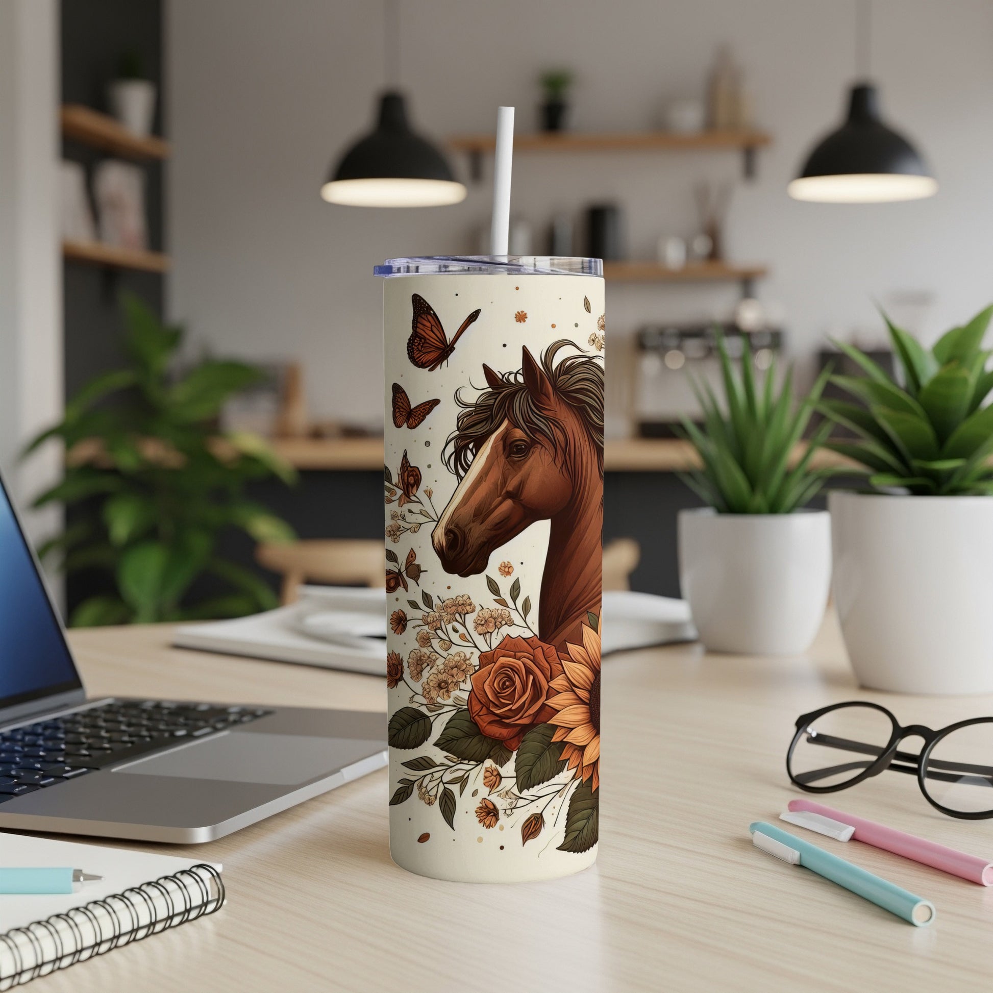 Horse and floral design on a cream colored tumbler with a straw.