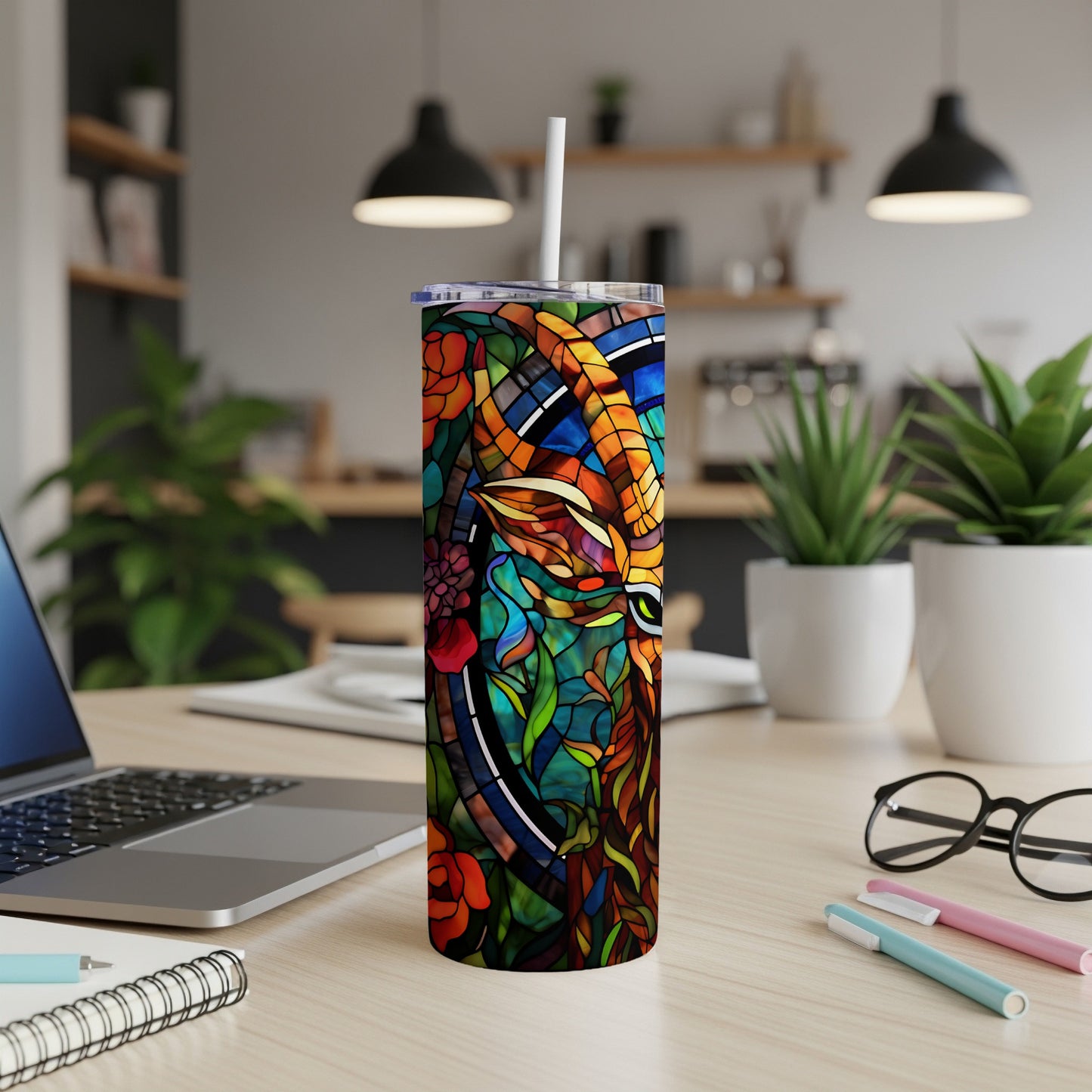Stained glass style tumbler with floral and animal motif.