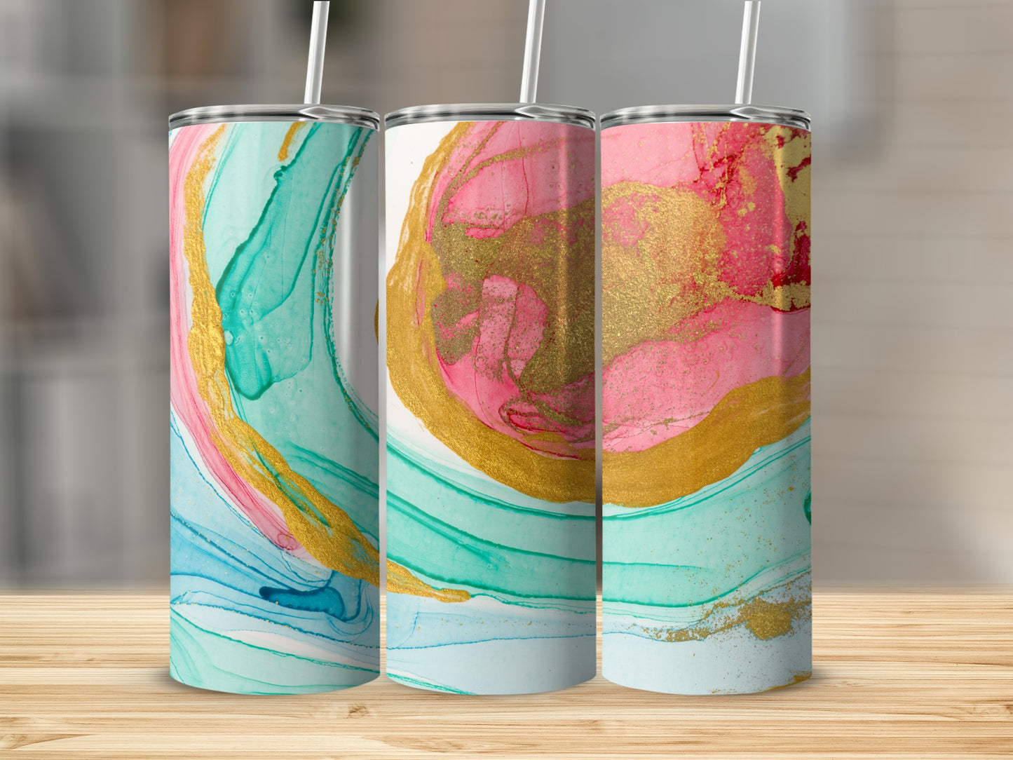 Three tumblers with abstract pink, blue, and gold marbled design.