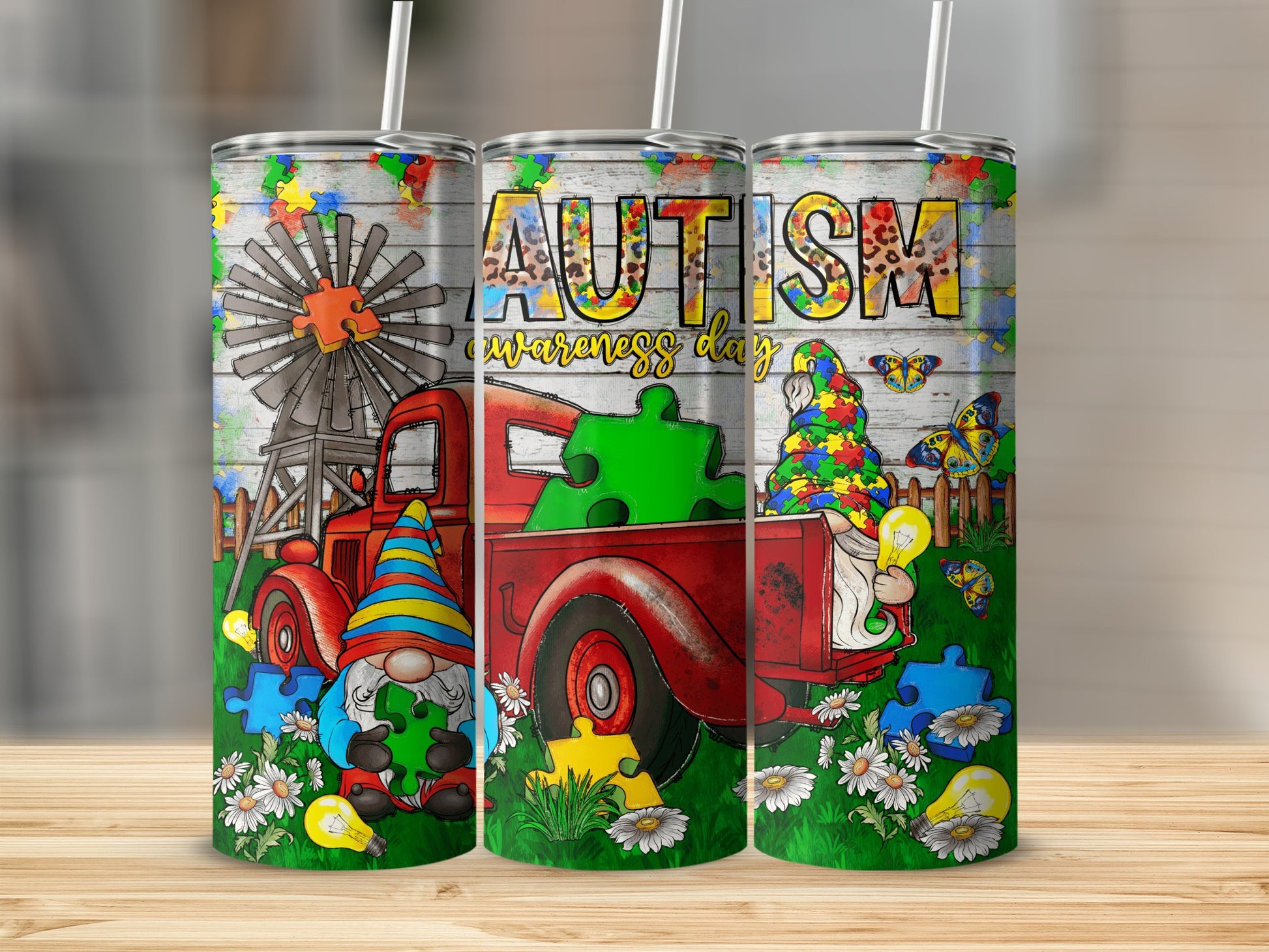 Tumbler with red truck, gnome, and "Autism awareness day" text.