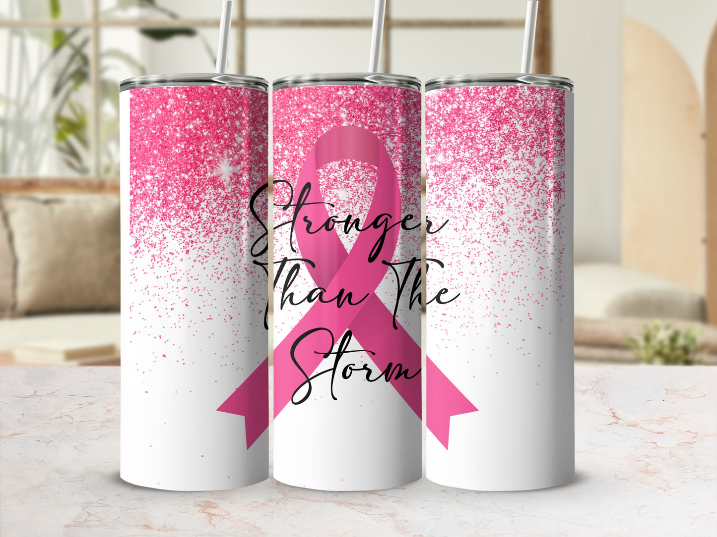 Pink glitter tumbler with "Stronger Than The Storm" text and ribbon.