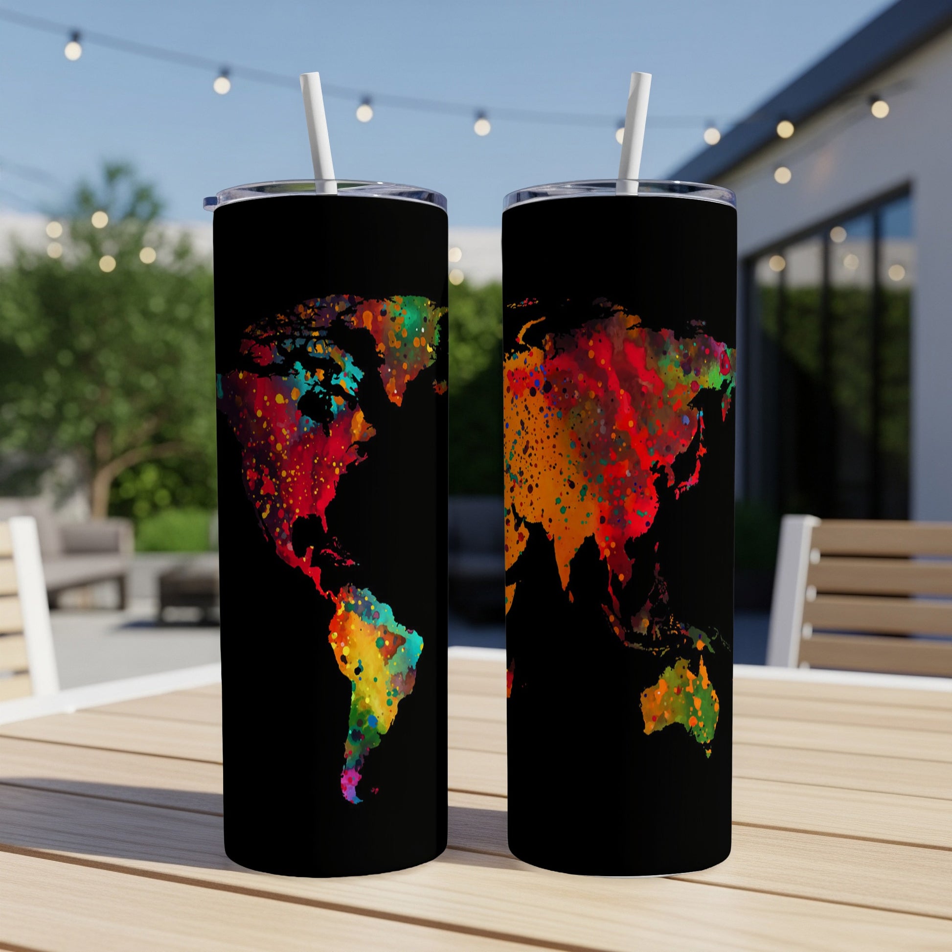 Two black tumblers with colorful splatter world map designs.