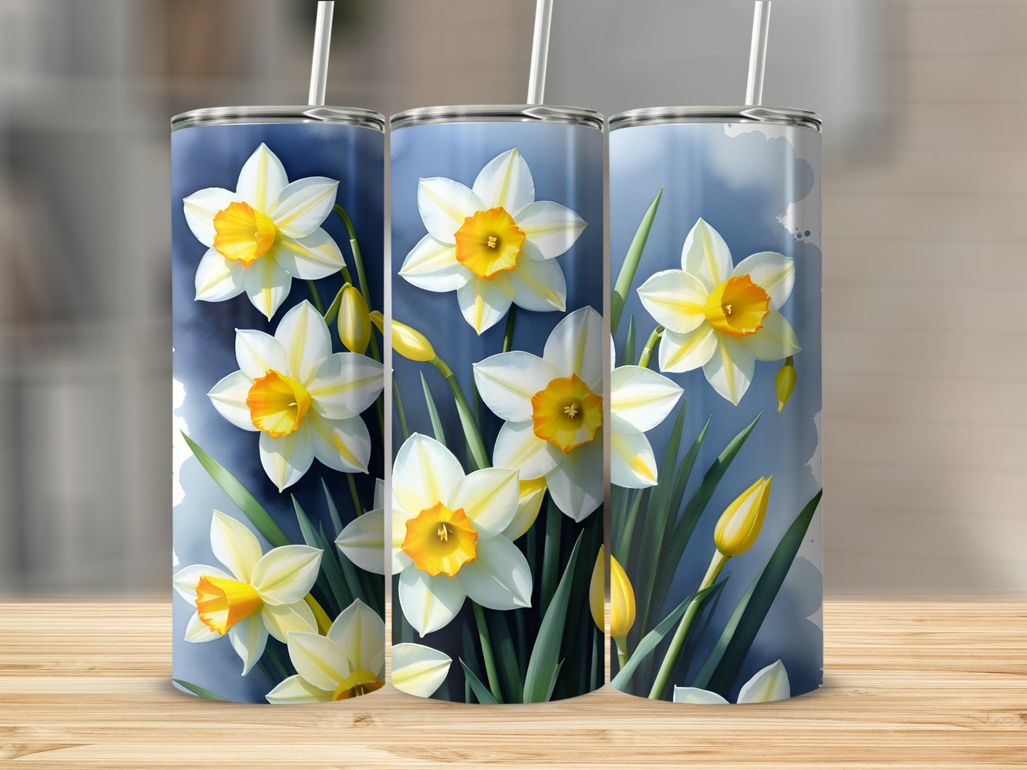 Three tumblers featuring white and yellow daffodils with green stems.