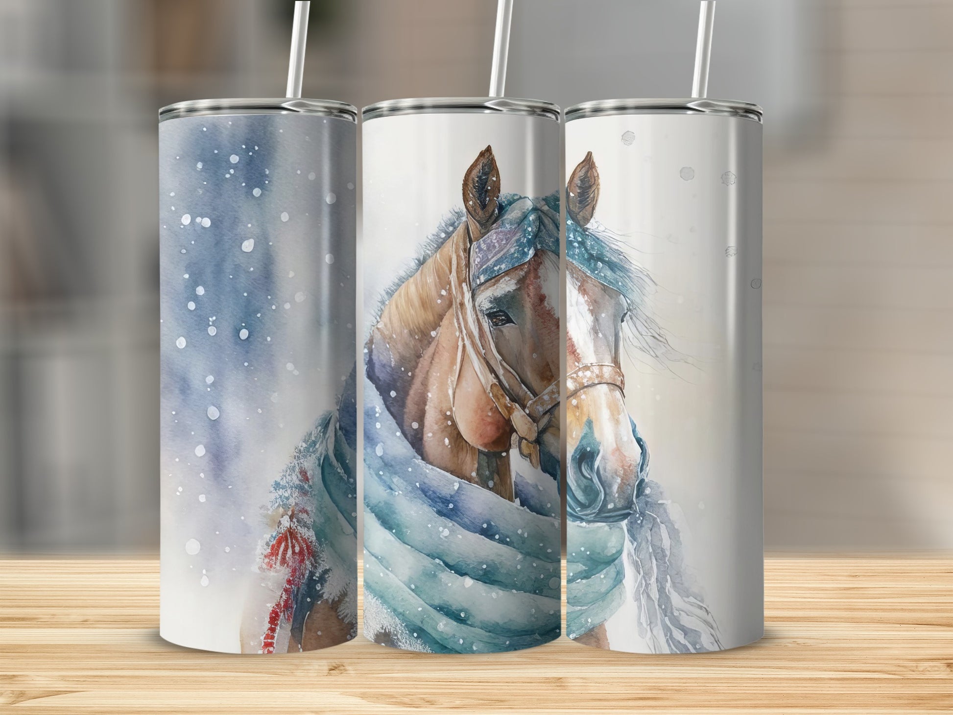 Three tumblers with watercolor horse and snowflake designs.