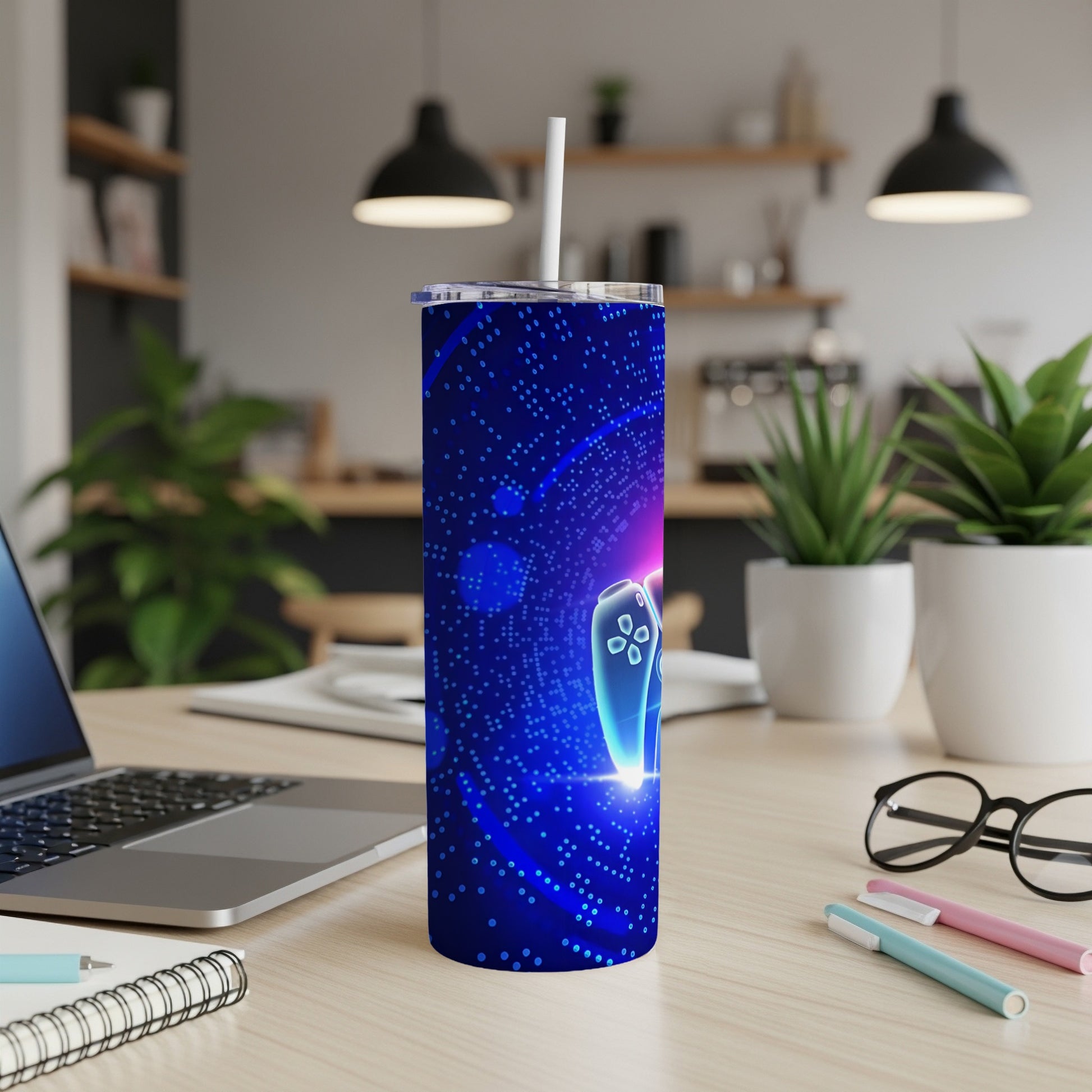 Blue tumbler with a glowing video game controller and circuit board pattern.