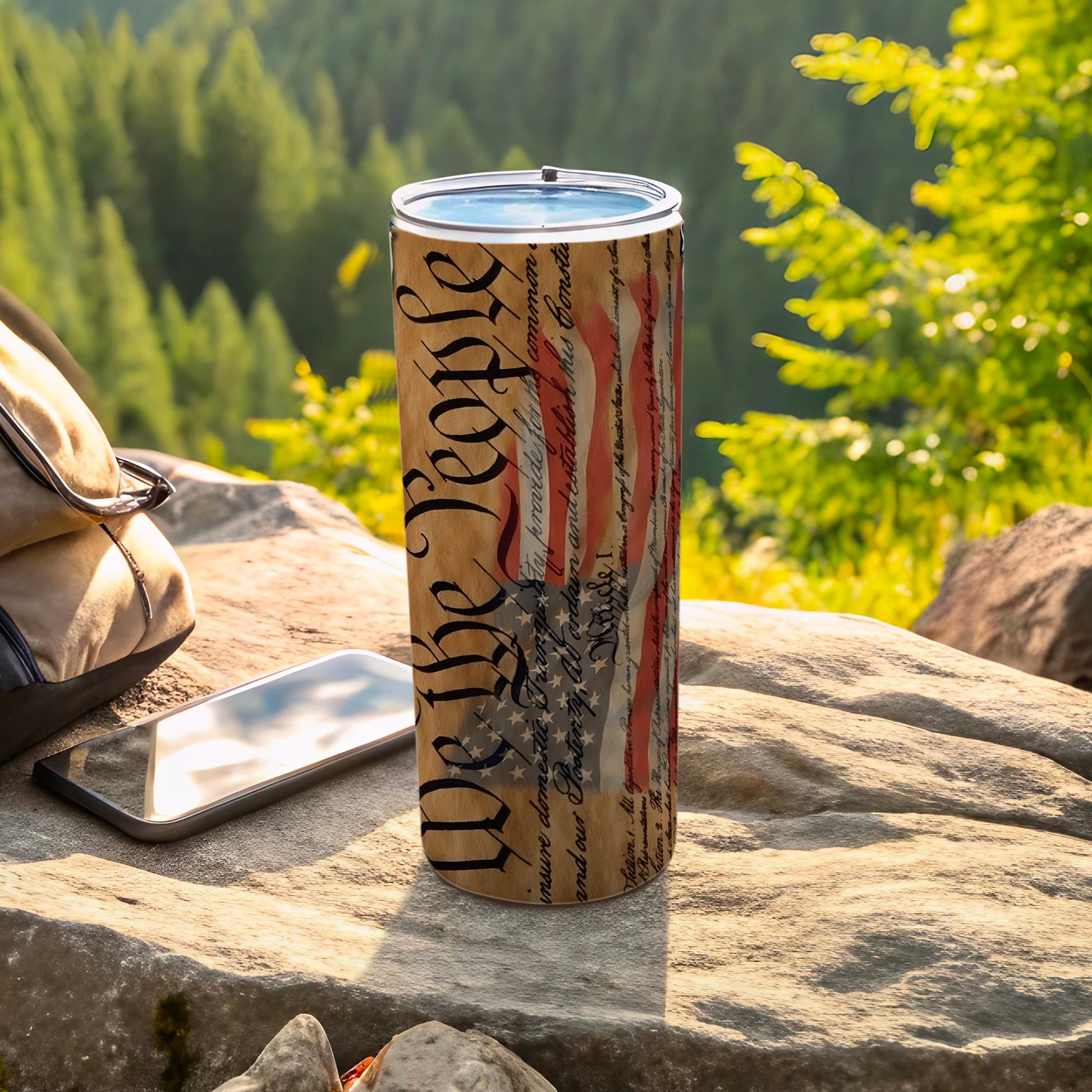 Tumbler with "We the People" Constitution text and American flag design.
