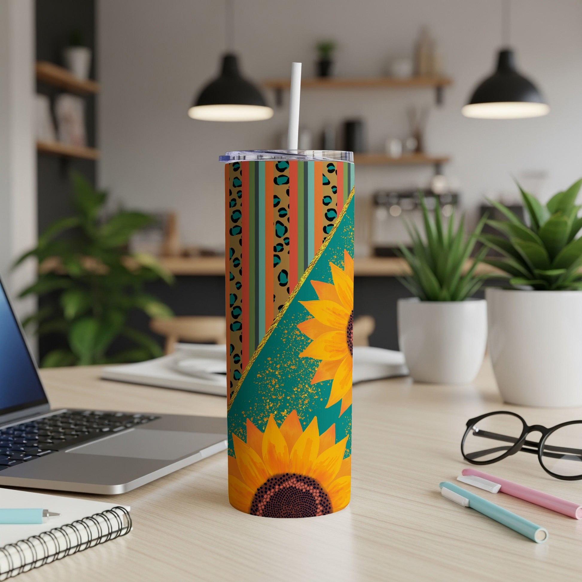 Tall tumbler with sunflowers, leopard print, and turquoise geometric design.