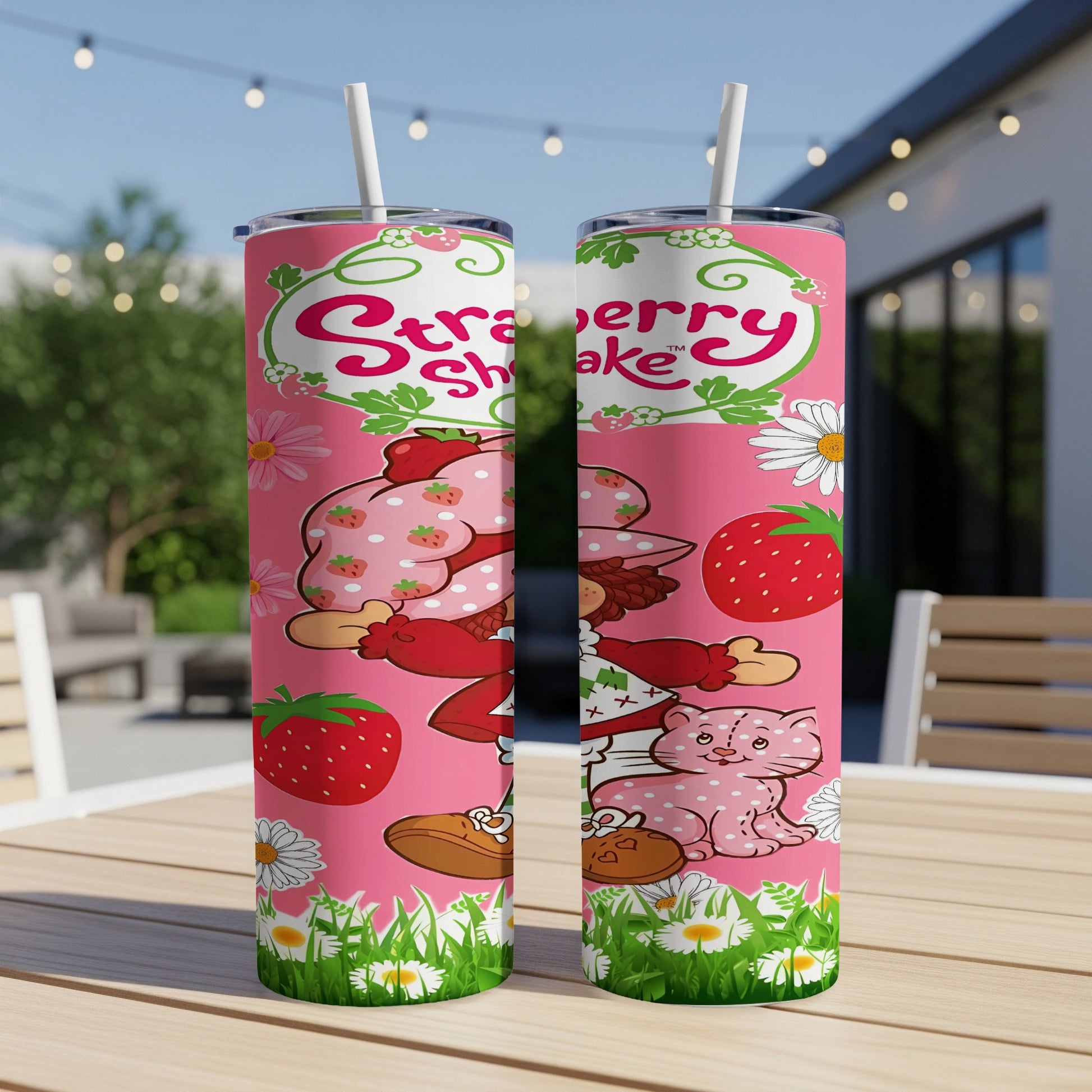 Strawberry Shortcake and Custard the cat on a pink tumbler with strawberries and daisies.