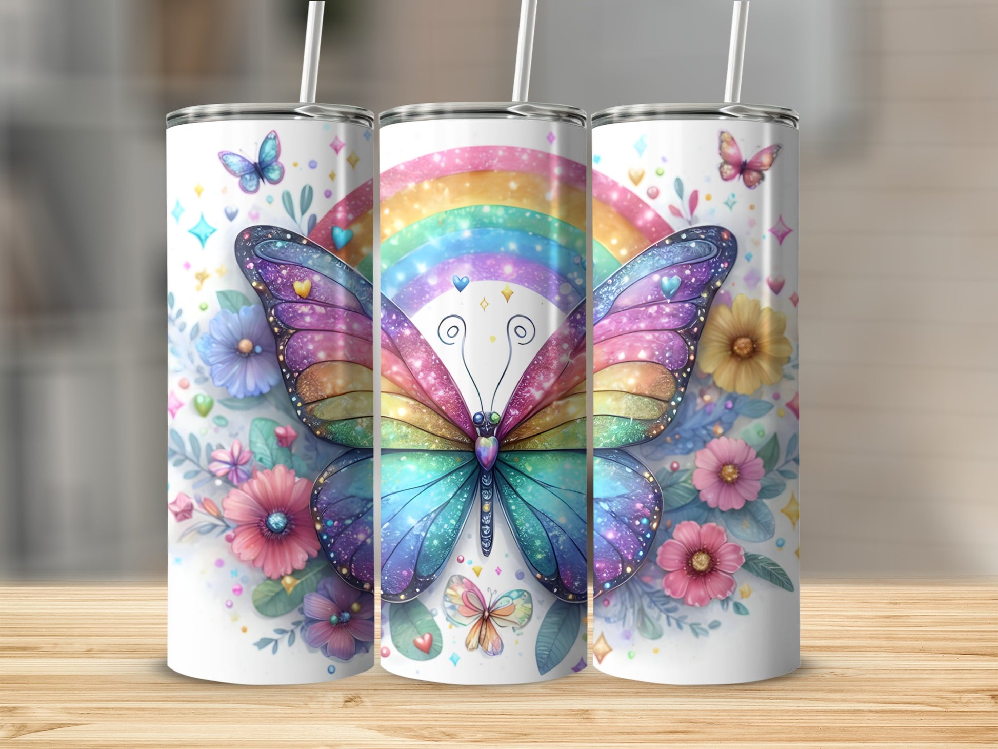 Three tumblers with colorful butterflies and floral designs.