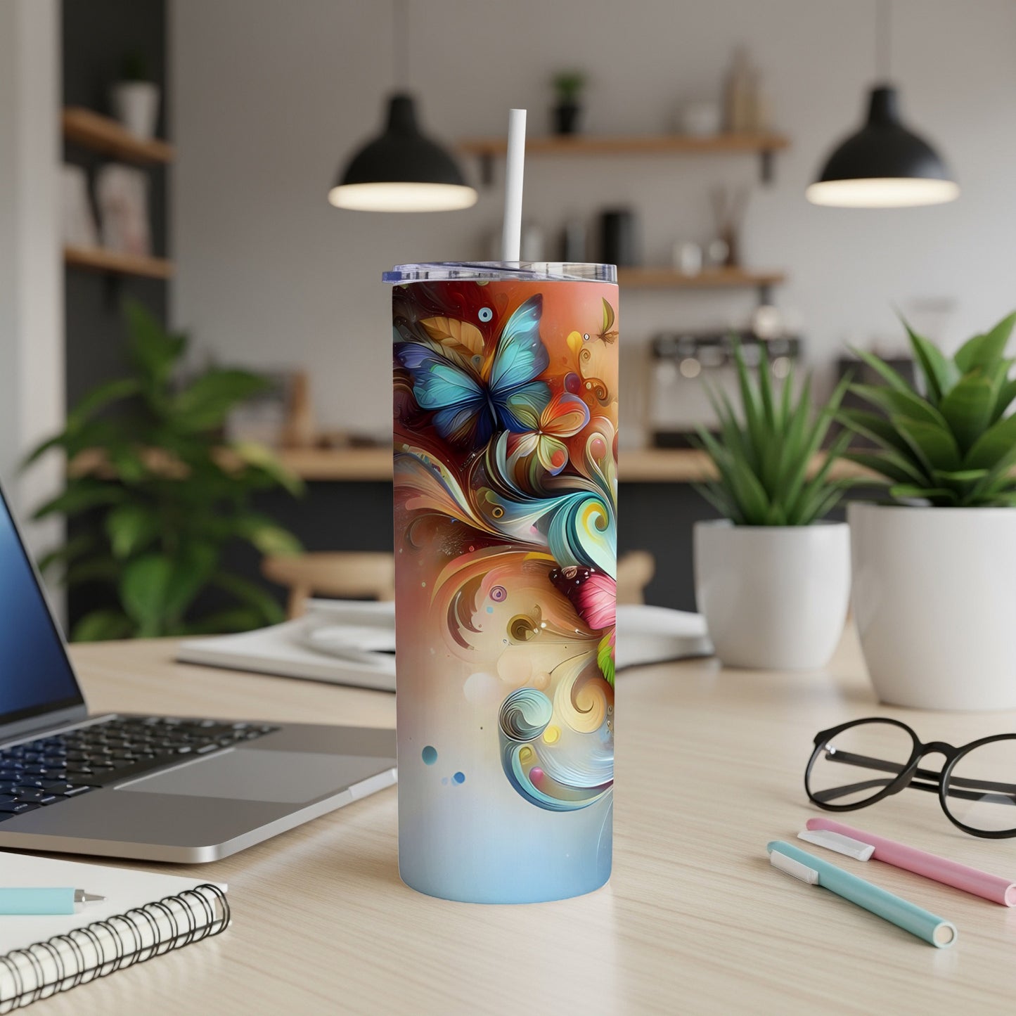 Tall tumbler with colorful butterfly and floral design.
