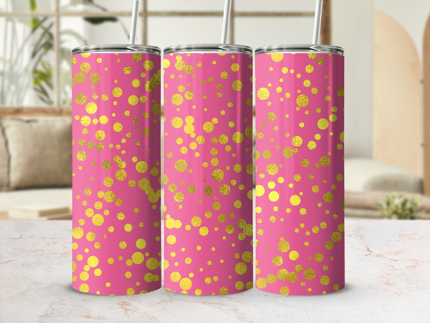 Three pink tumblers with gold polka dot pattern and straws visible.