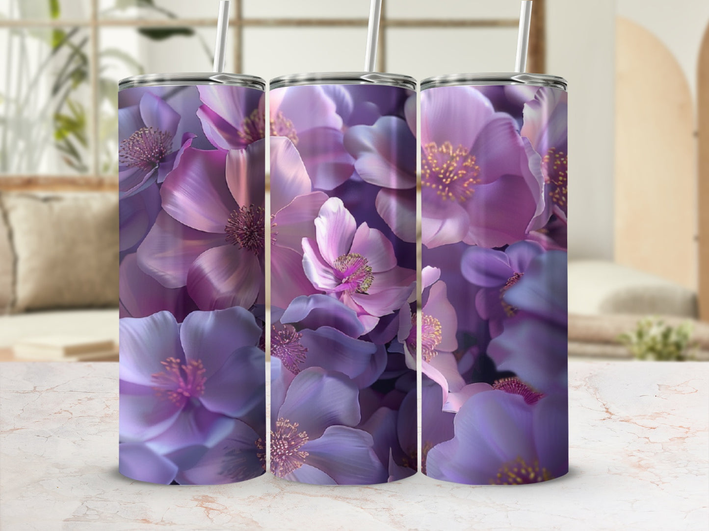 Three tumblers adorned with vibrant purple floral patterns.