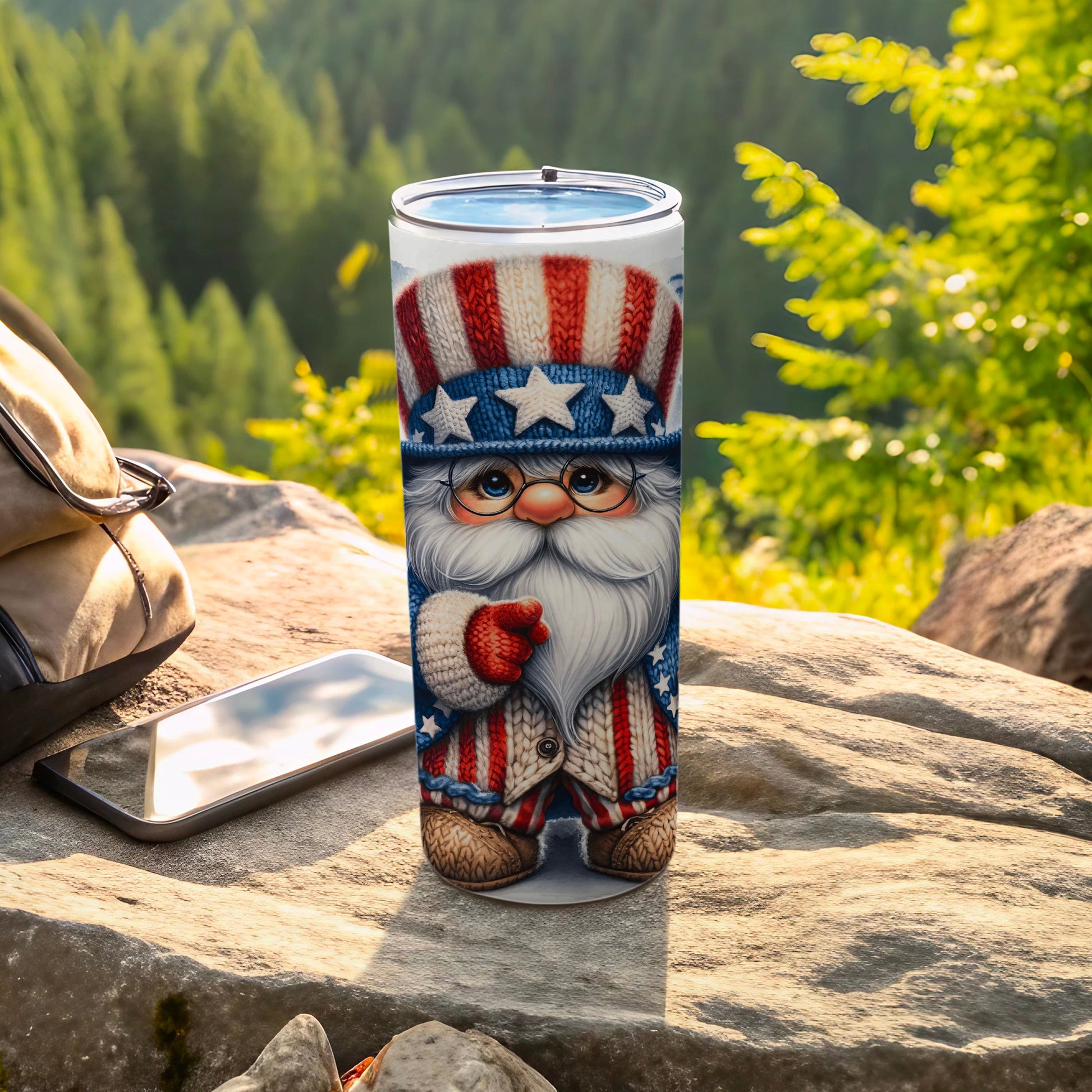 Patriotic Santa Claus tumbler with stars and stripes, on a rock outdoors.