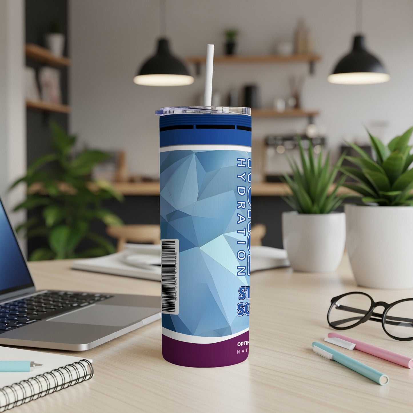 Blue and purple tumbler with "HYDRATION" text on a desk.