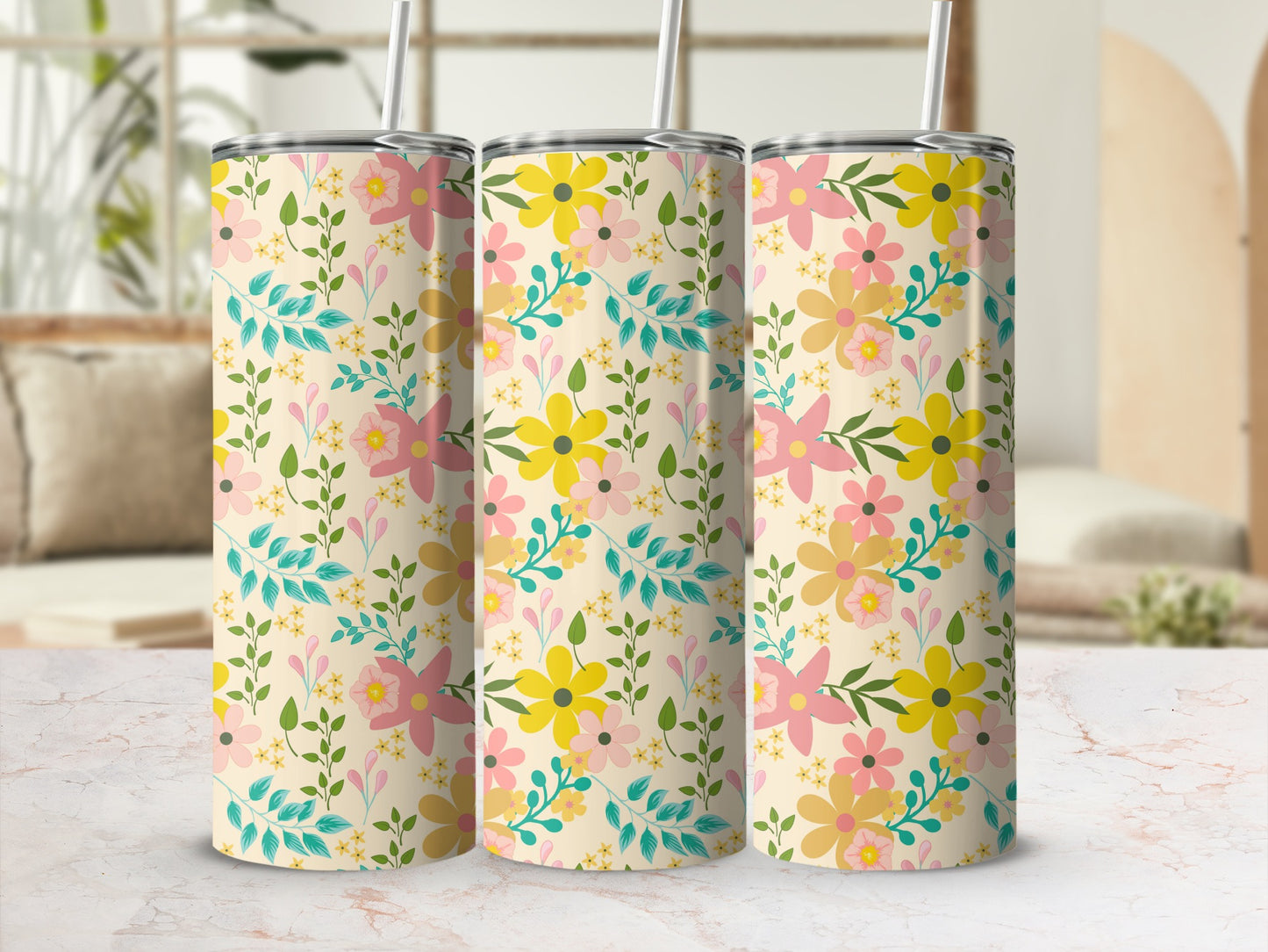 Three tumblers with a cream background and a scattered floral and leaf pattern.