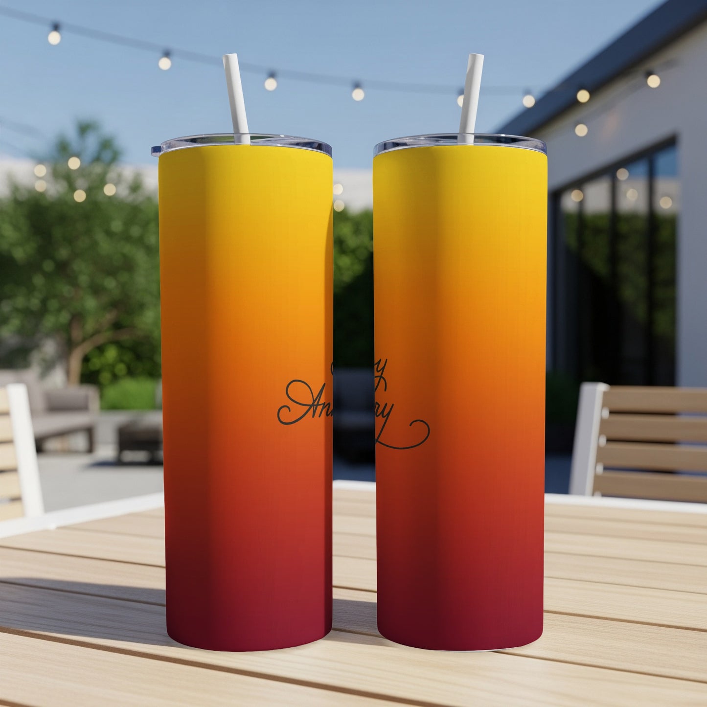Two sunset gradient tumblers with "Stay Cozy" text on a wooden table.