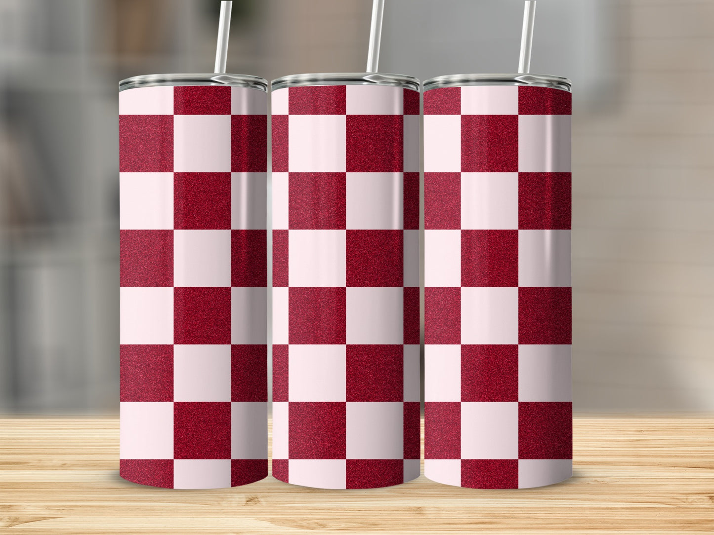 Three tall tumblers with a red and white checkerboard glitter design.