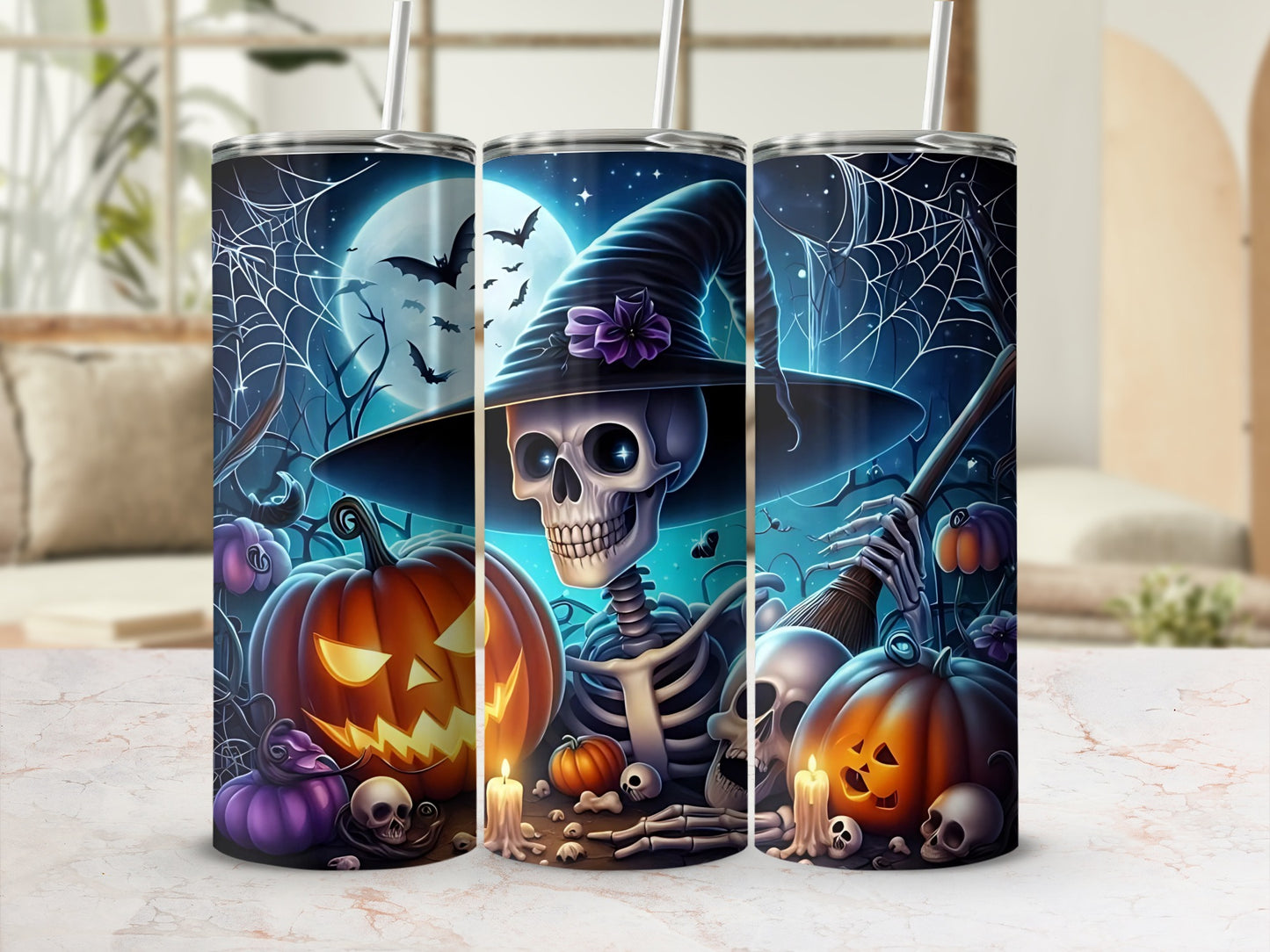 Three tumblers with a Halloween theme: a skeleton in a witch hat, pumpkins, bats, and spiderwebs.