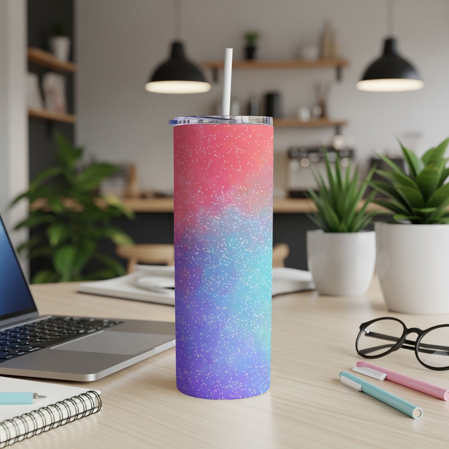 Tumbler with pink, blue, and purple gradient and white speckles.