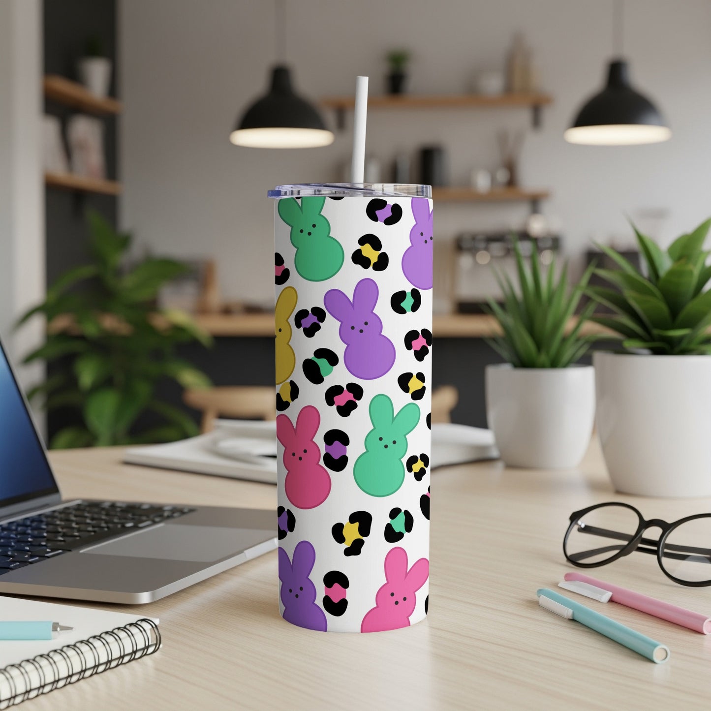 White tumbler with colorful Peeps bunnies and leopard print pattern.