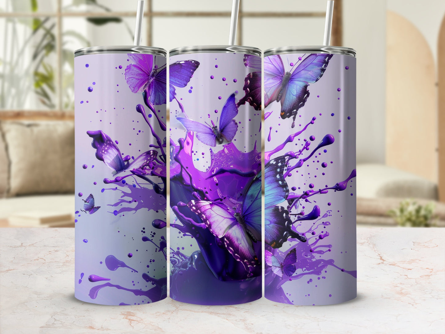 Three tumblers with purple butterfly and paint splatter design.