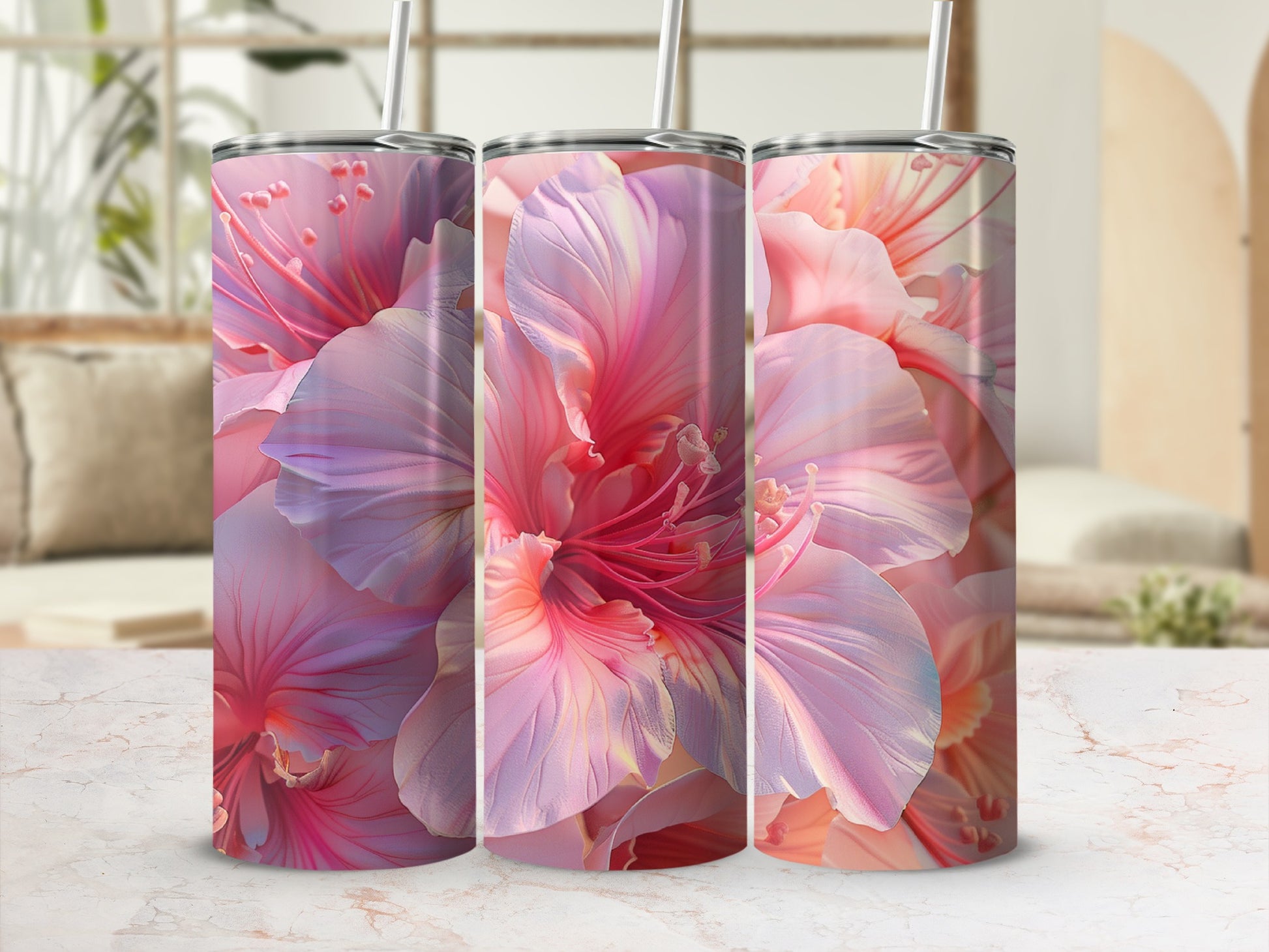 Pink floral pattern on three tumblers with straws.