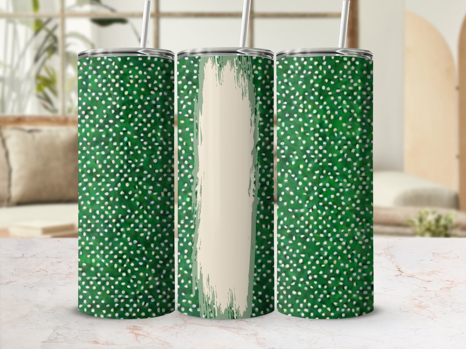 Three green tumblers with white polka dots and a cream stripe.