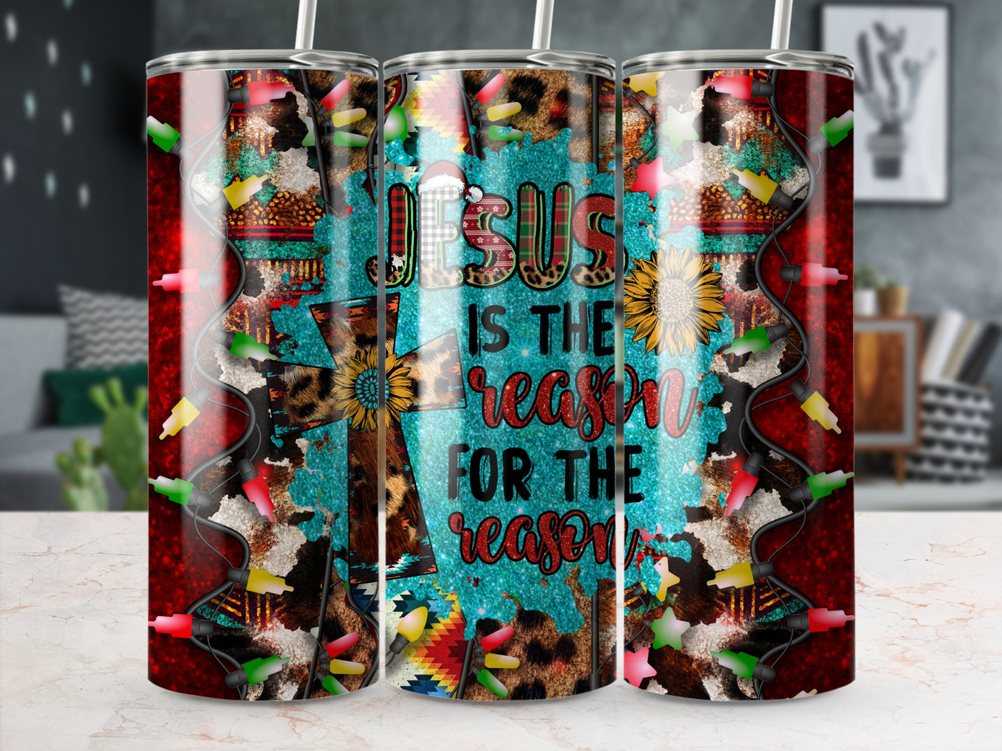Tumbler with "Jesus is the reason for the season" text and festive lights.