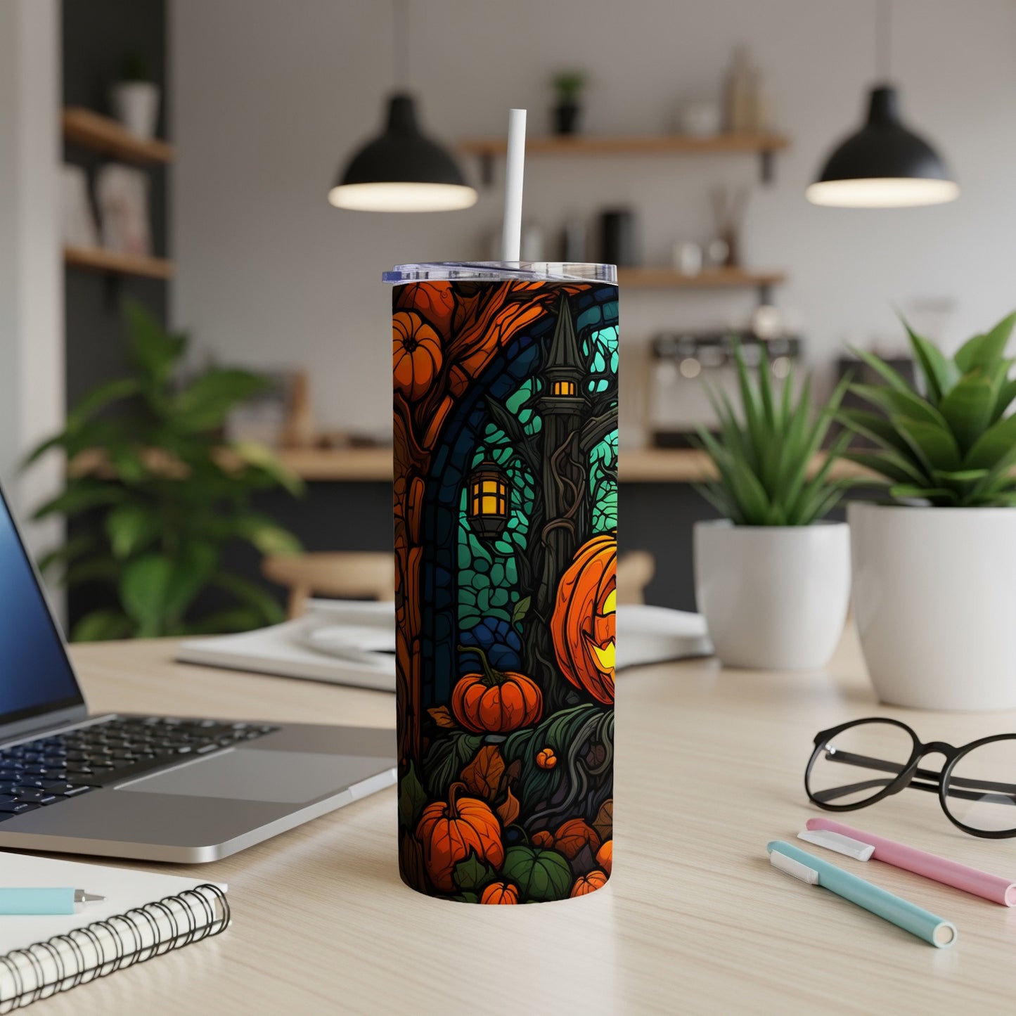 Halloween tumbler with pumpkins, bats, and a gothic-style archway.