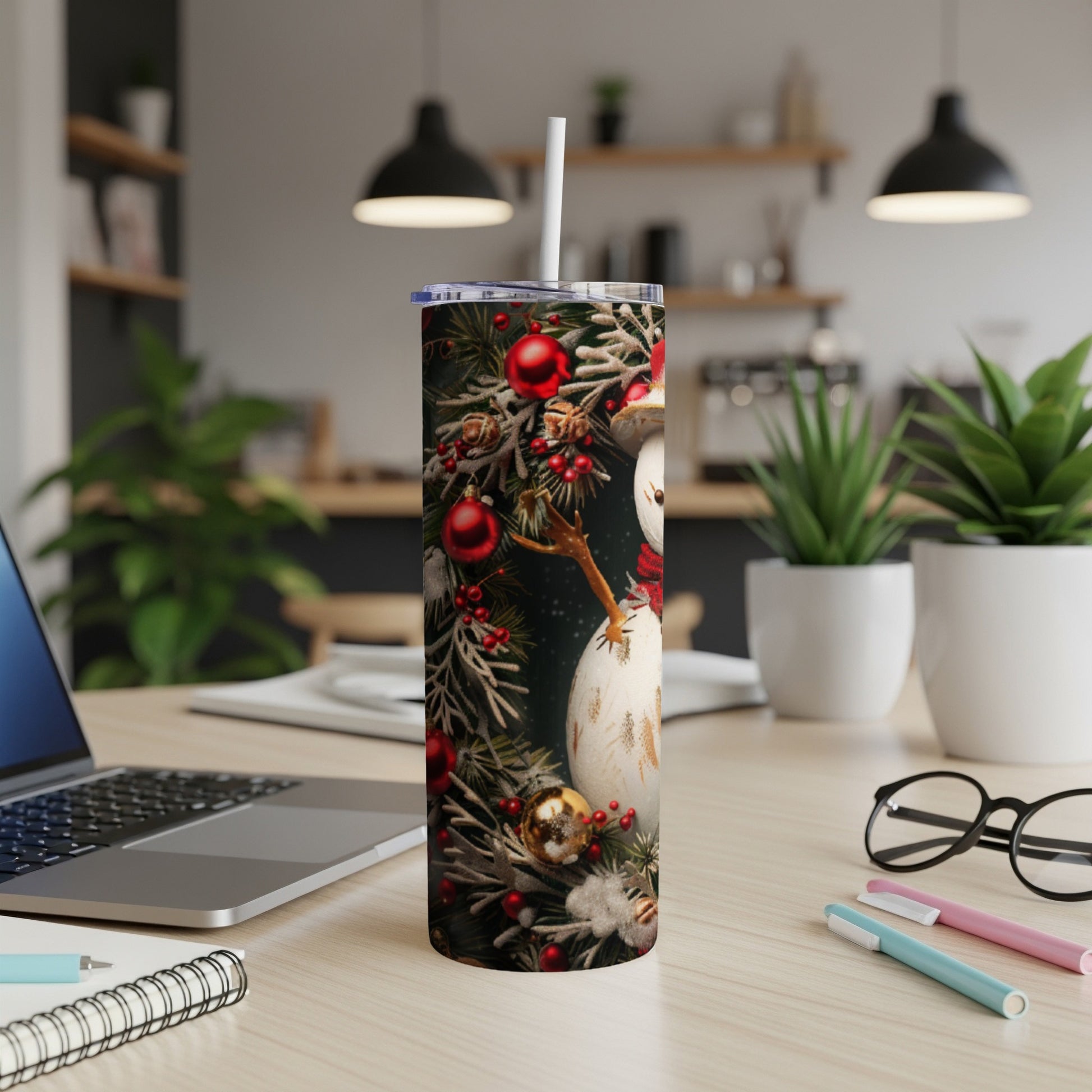 Snowman with festive Christmas ornaments on a skinny tumbler.