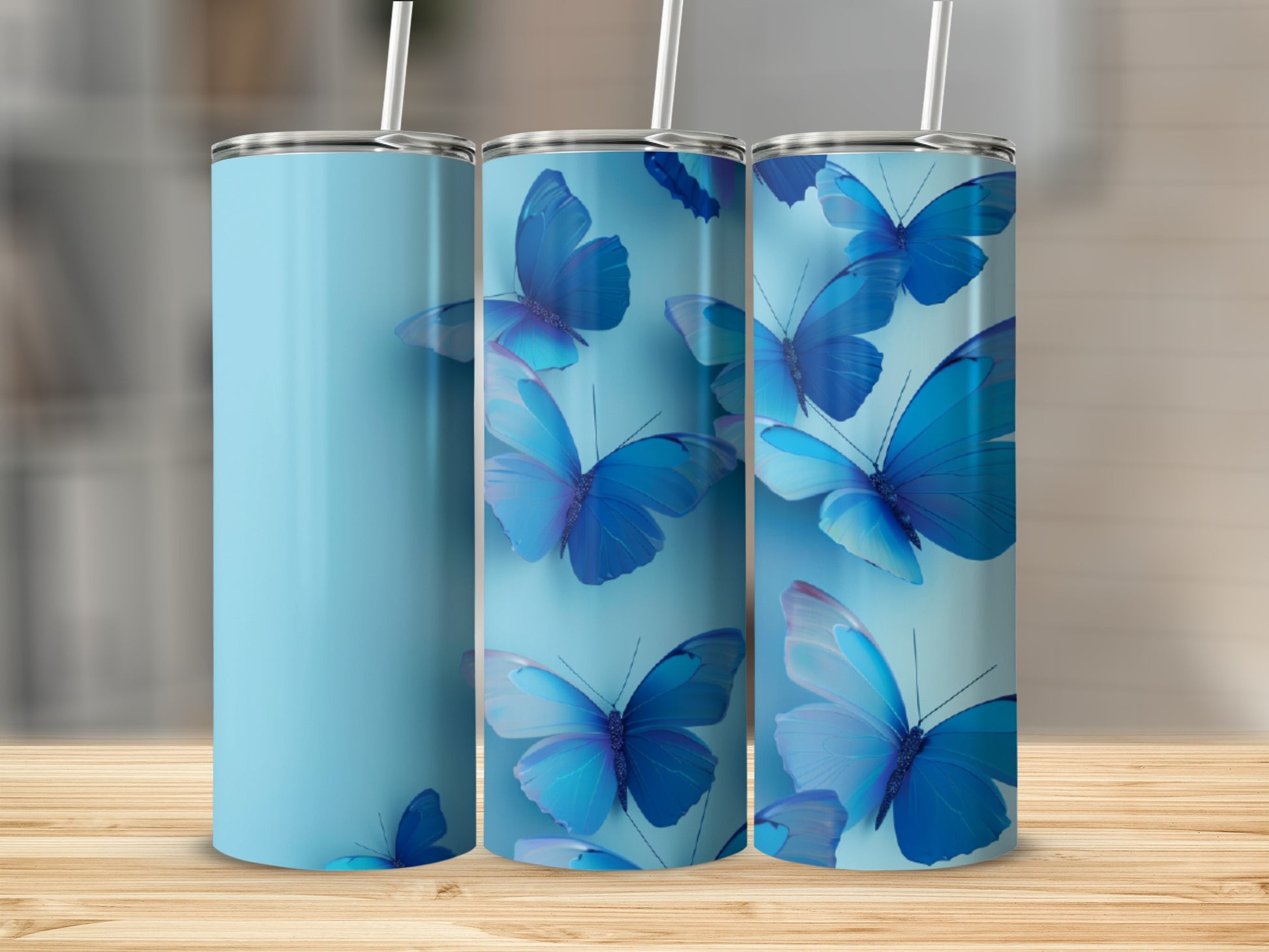 Blue butterflies on a light blue tumbler with a white straw.