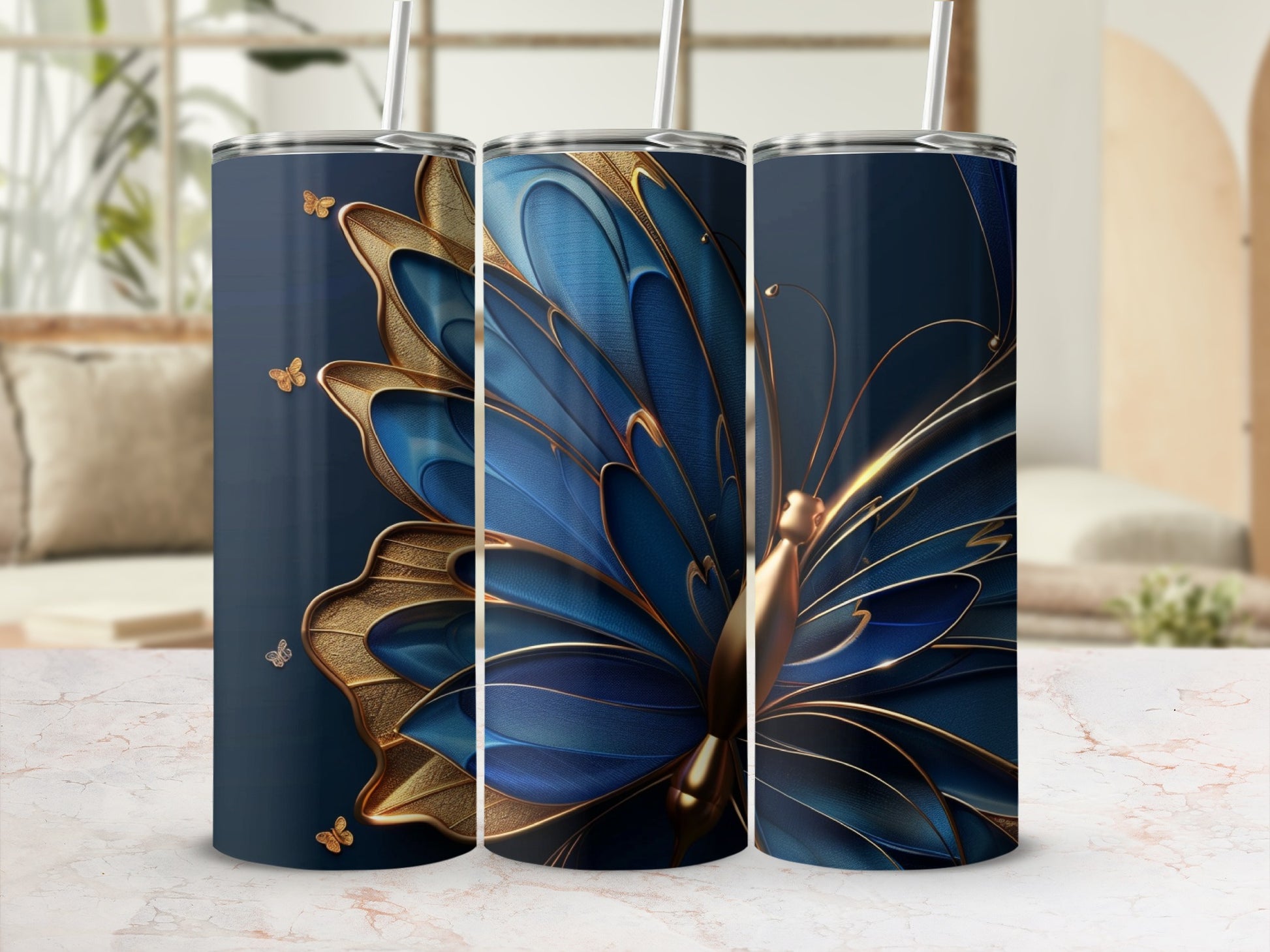 Three tumblers featuring a blue and gold butterfly design on a dark blue background.