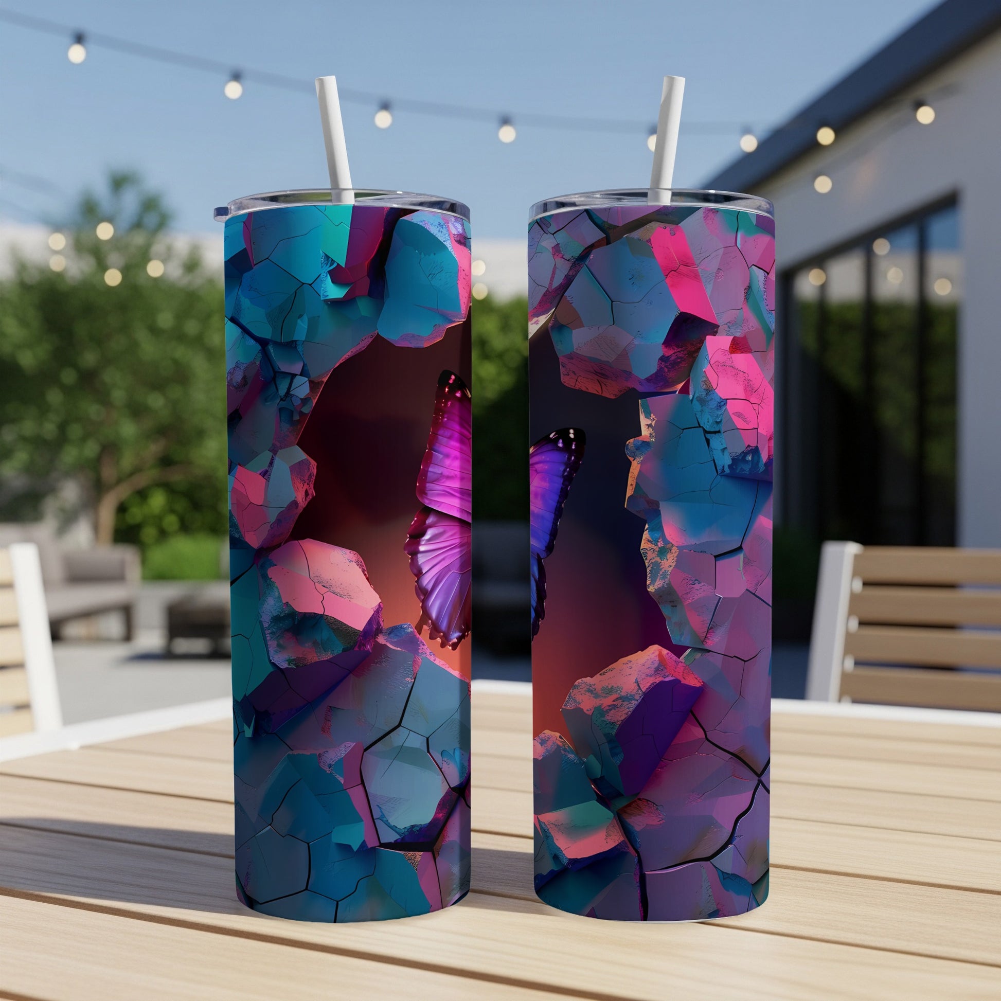 Two tumblers with a purple butterfly bursting through cracked colorful rock.