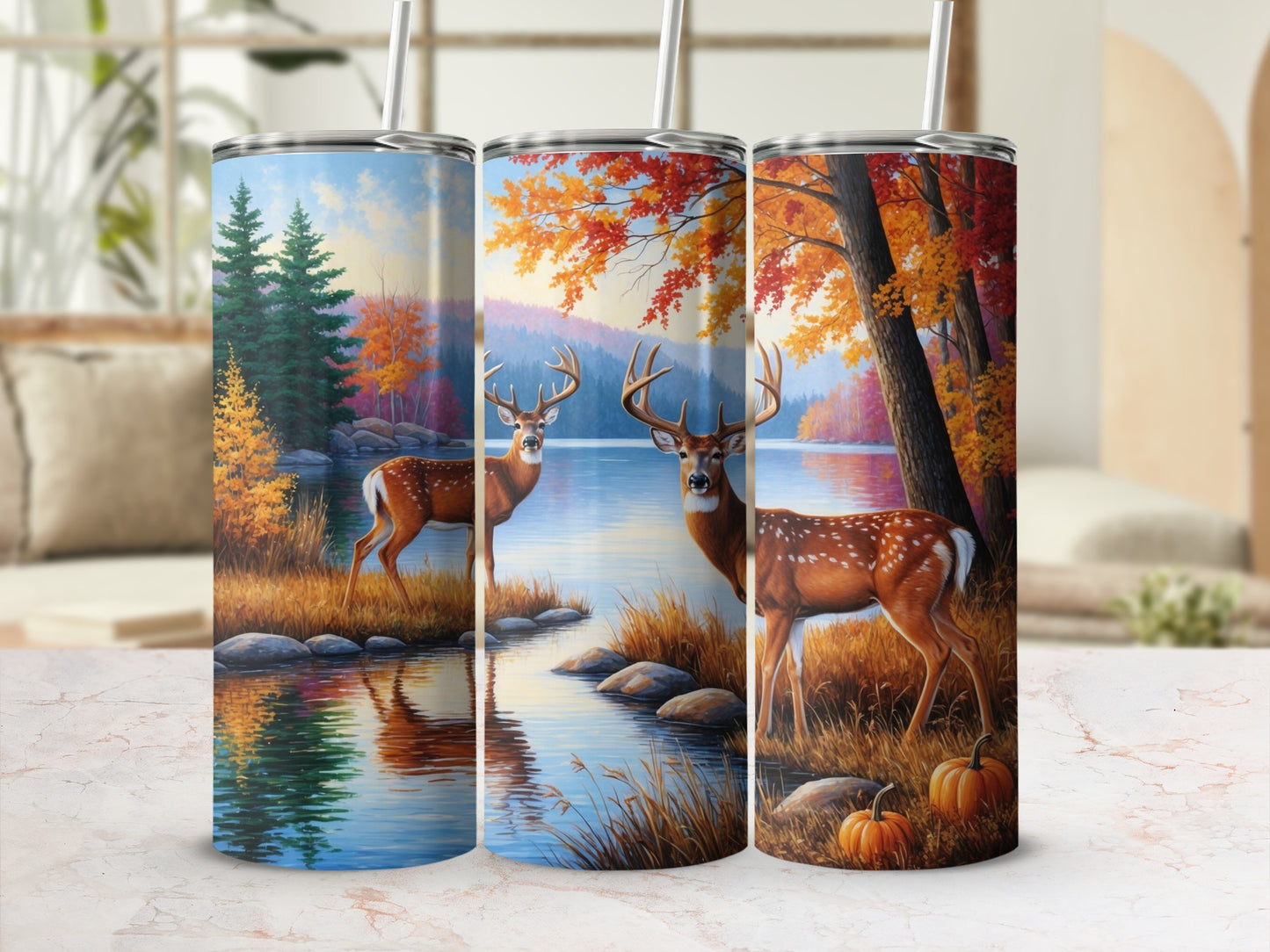 Three tumblers with fall deer and lake scene designs.