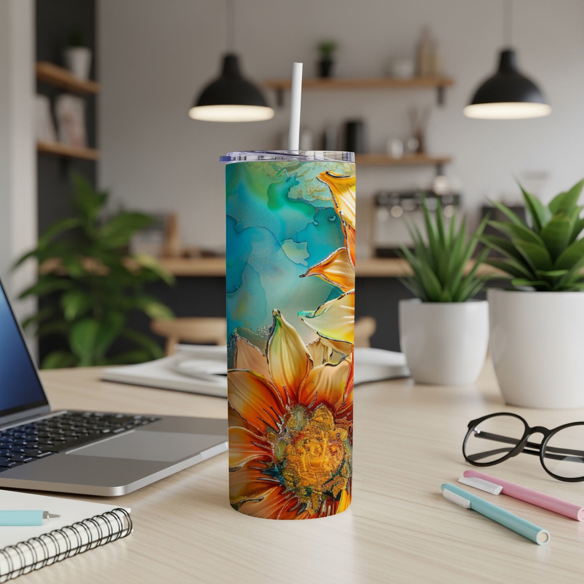 Tall tumbler with orange flower design and abstract watercolor background.