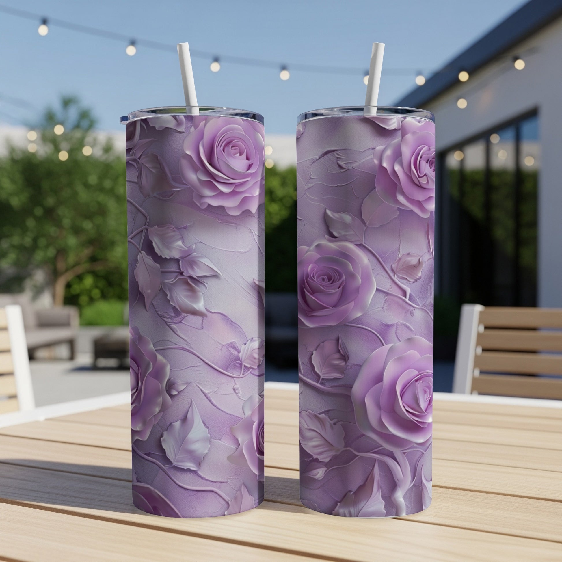 Two tall tumblers with embossed lavender roses on a wooden table.