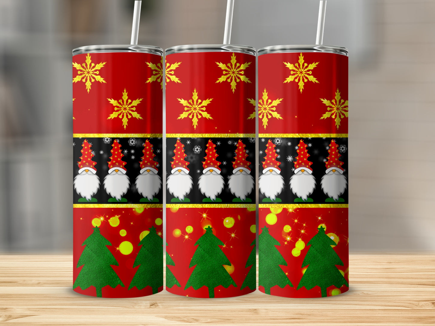 Three red tumblers with gnome and Christmas tree design.