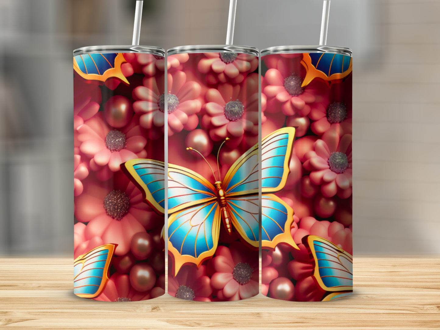 Three tumblers with a blue and gold butterfly on a floral background.