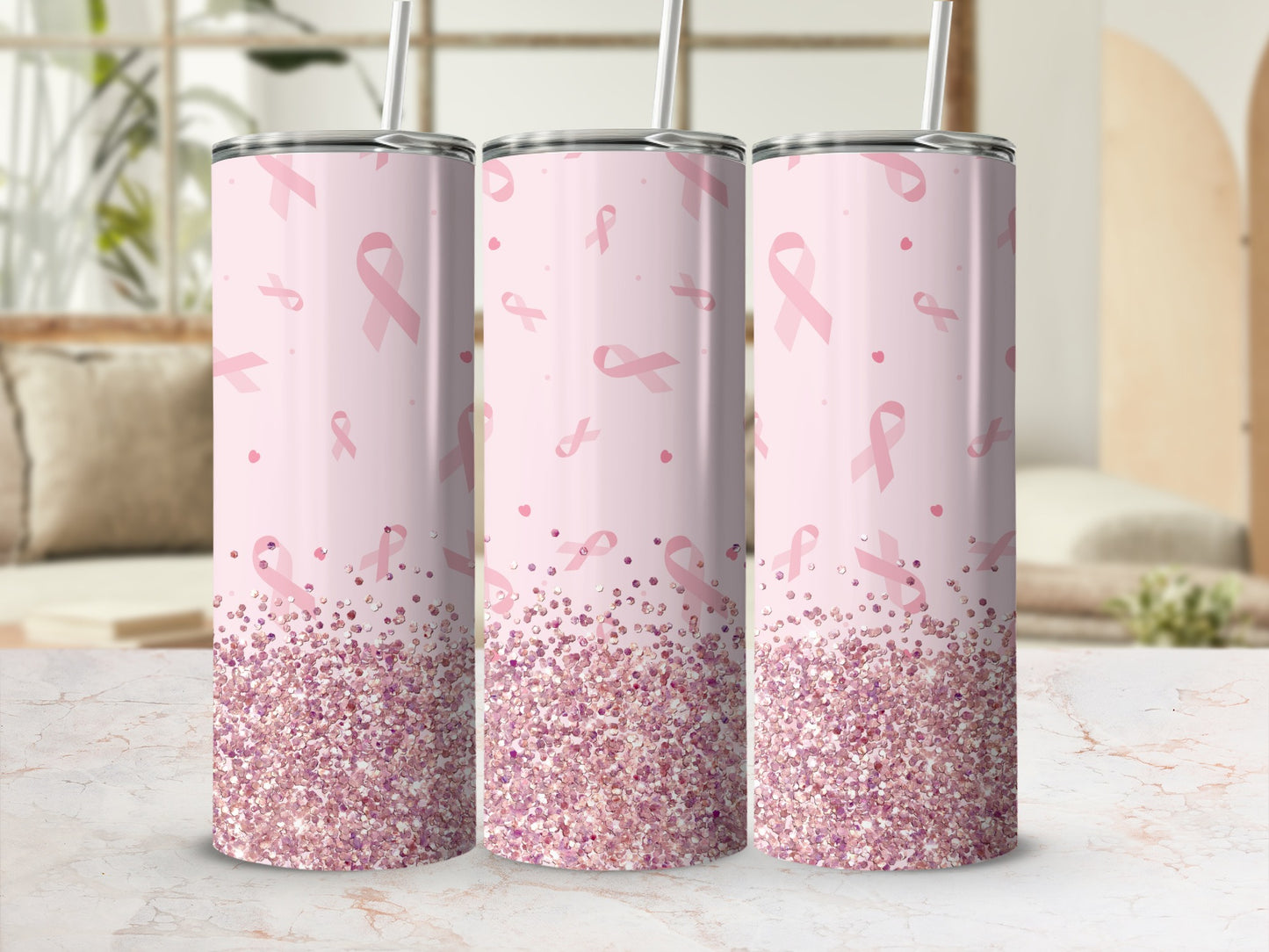 Pink glitter tumbler with breast cancer awareness ribbons and straw.