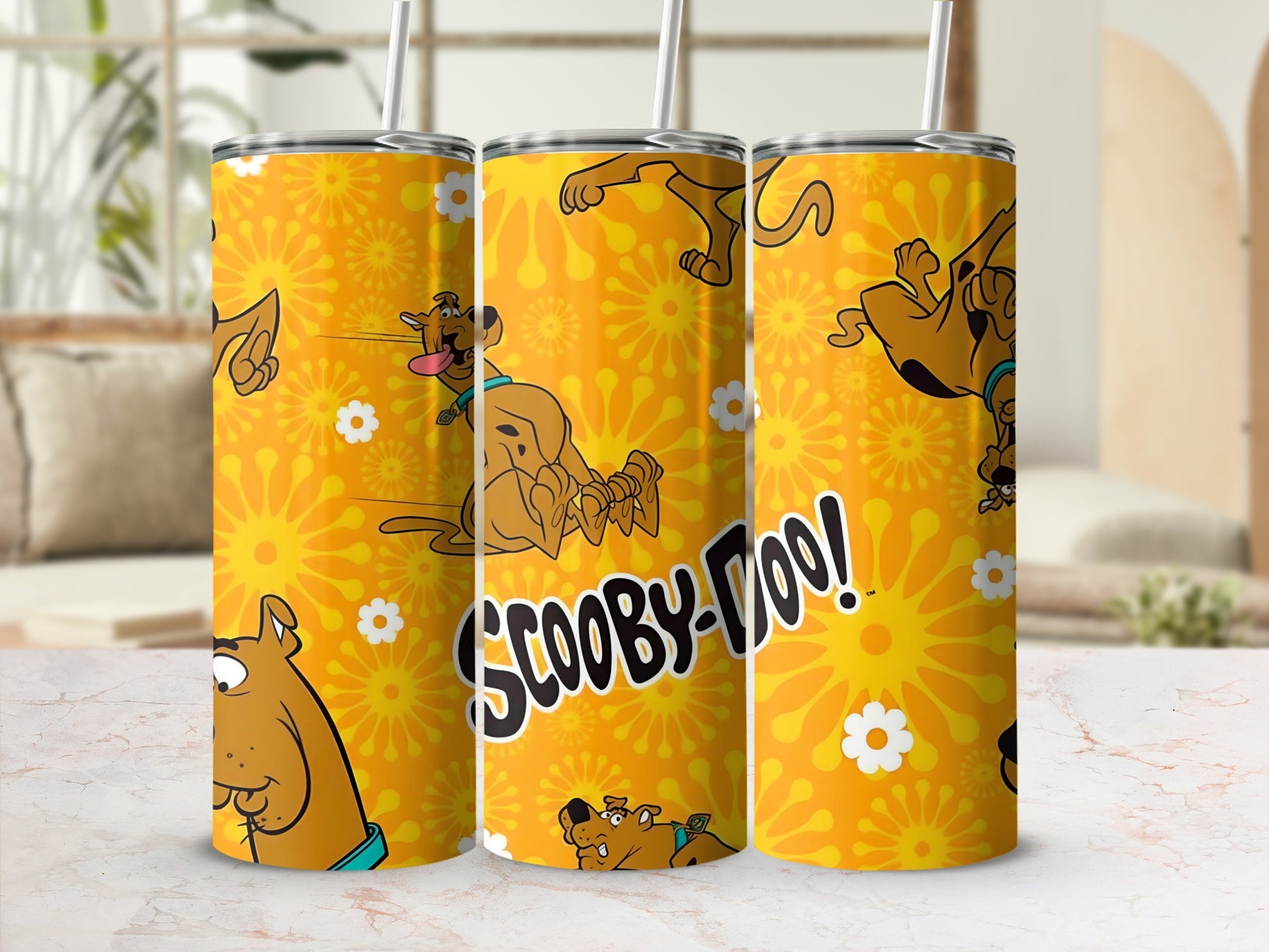 Scooby-Doo tumbler with cartoon graphics and a floral yellow background.